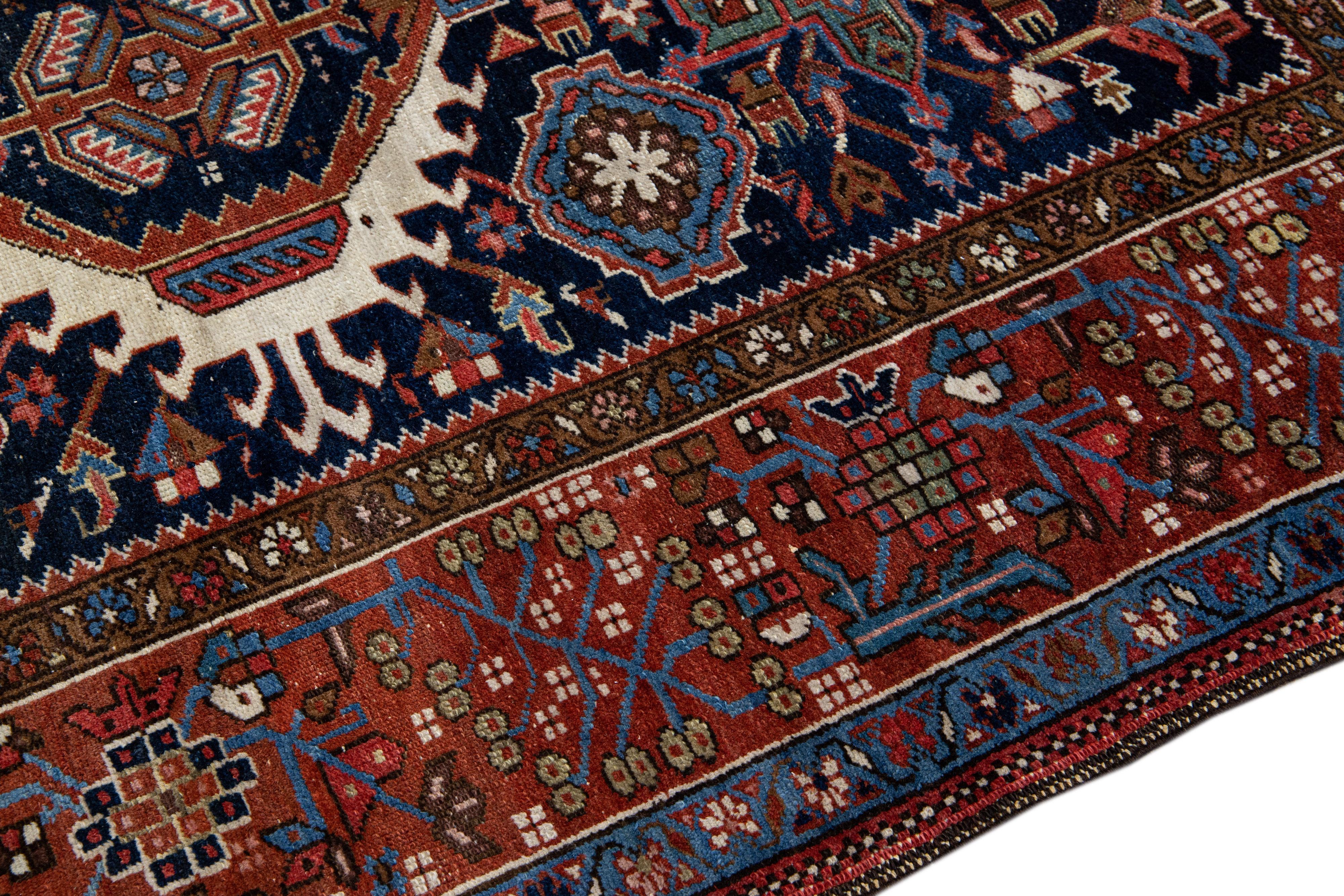 20th Century Antique Heriz Handmade Medallion Blue and Red Wool Rug For Sale