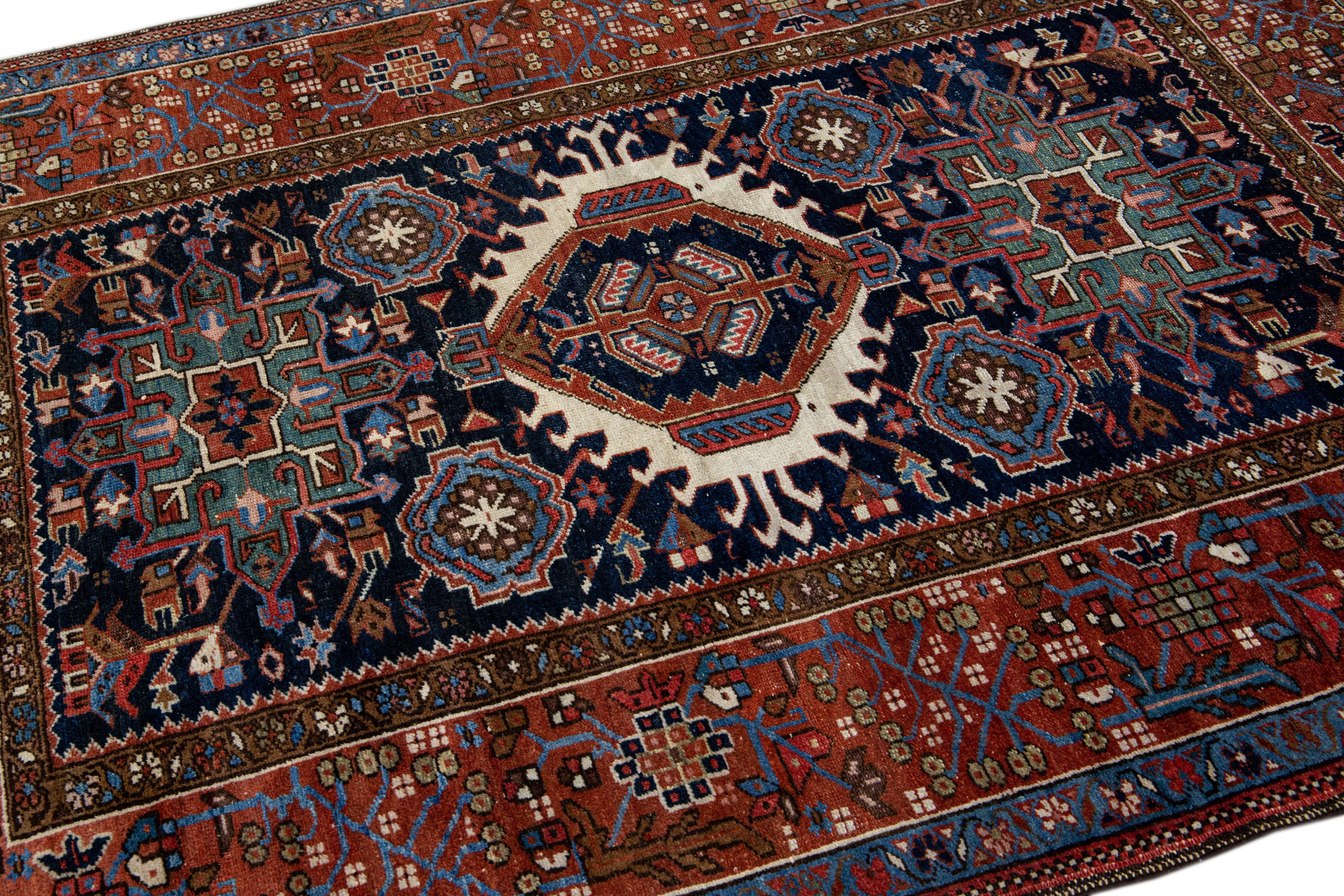 Antique Heriz Handmade Medallion Blue and Red Wool Rug For Sale 1