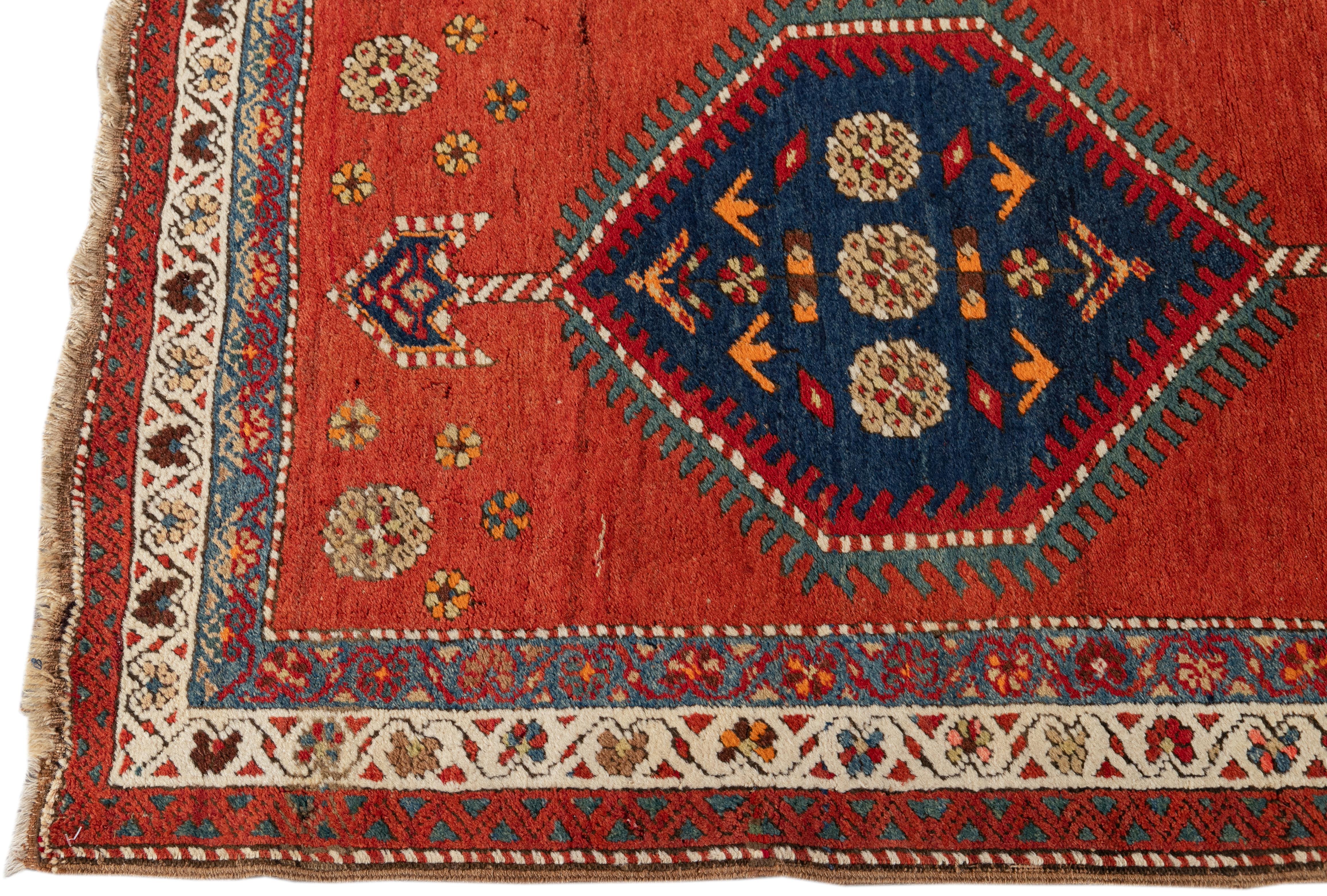 Beautiful 20th-century Heriz hand-knotted wool runner with a rust-orange field. This Piece has multicolor accents in a gorgeous tribal design.

This rug measures: 3'3