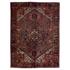Ancien tapis persan Heriz en laine rouille à motif de médaillons, fait à la main