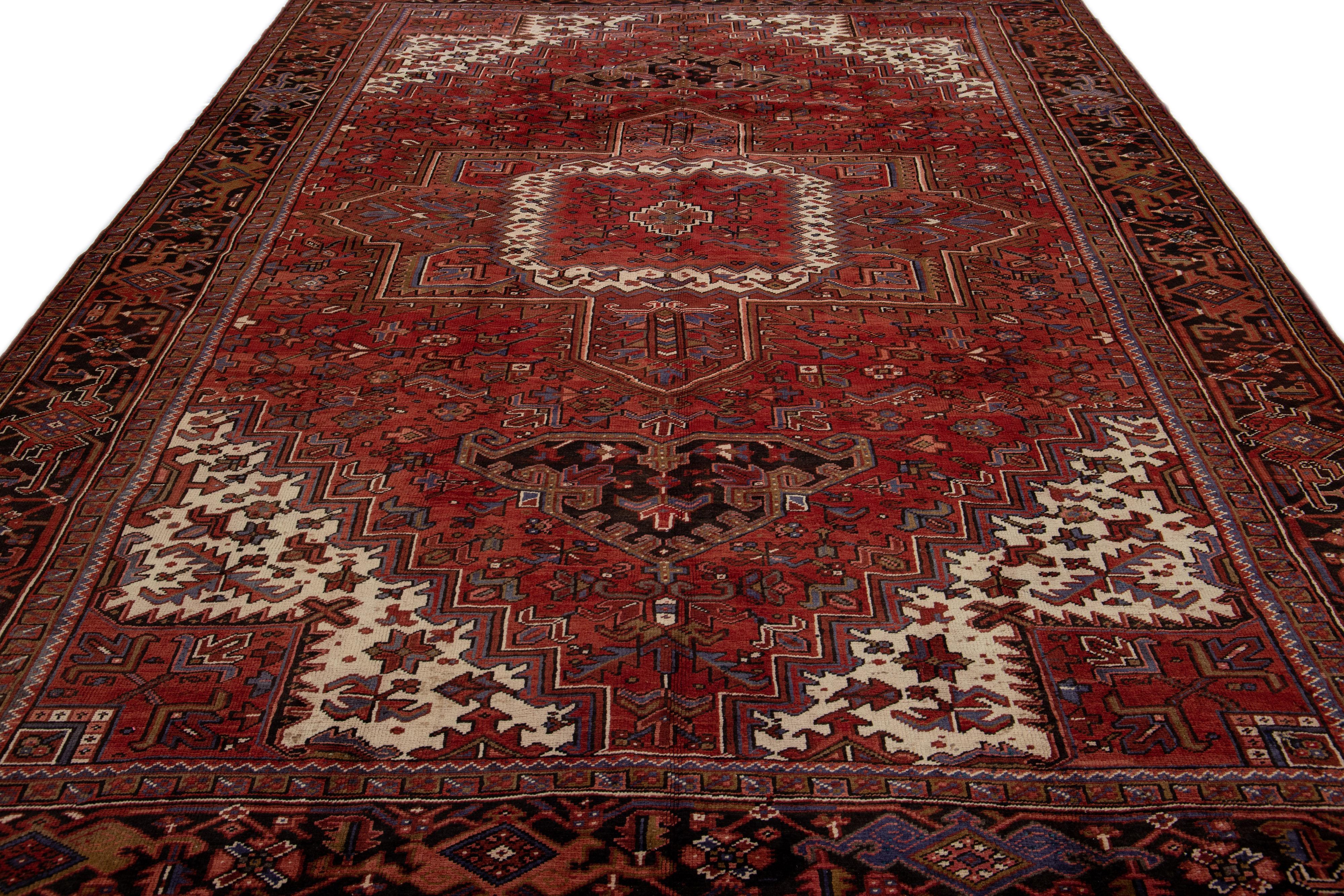 Heriz Serapi Antique Heriz Red Handmade Persian Wool Rug with Medallion Motif For Sale