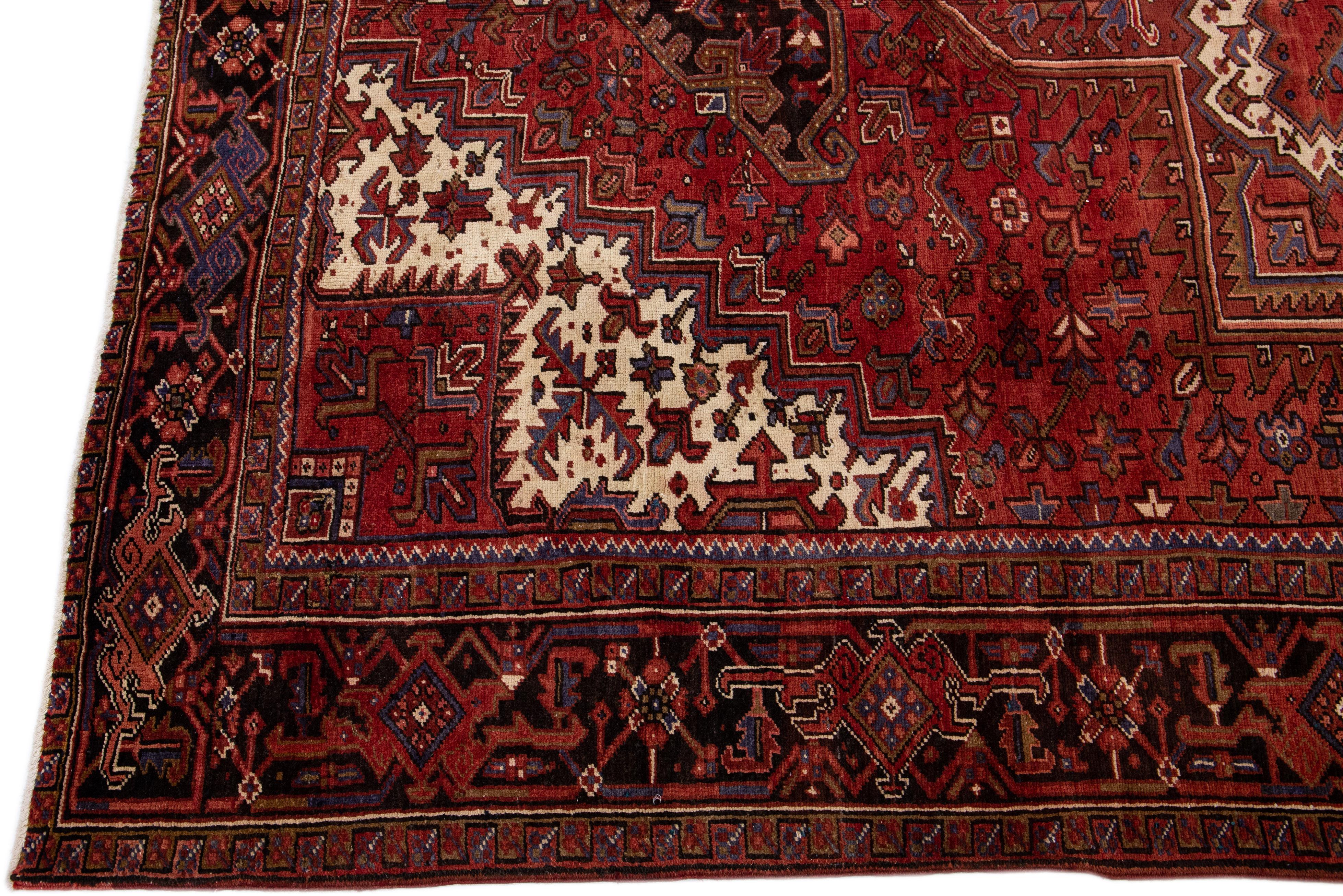 Hand-Knotted Antique Heriz Red Handmade Persian Wool Rug with Medallion Motif For Sale
