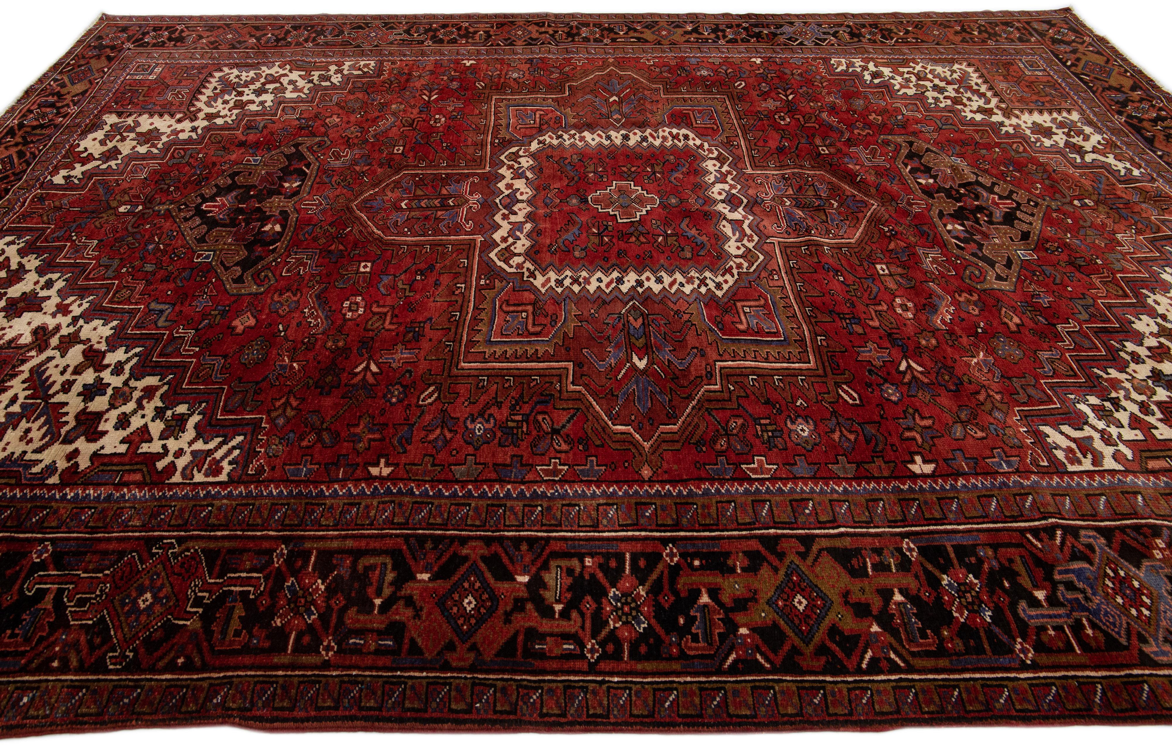 Antique Heriz Red Handmade Persian Wool Rug with Medallion Motif In Good Condition For Sale In Norwalk, CT