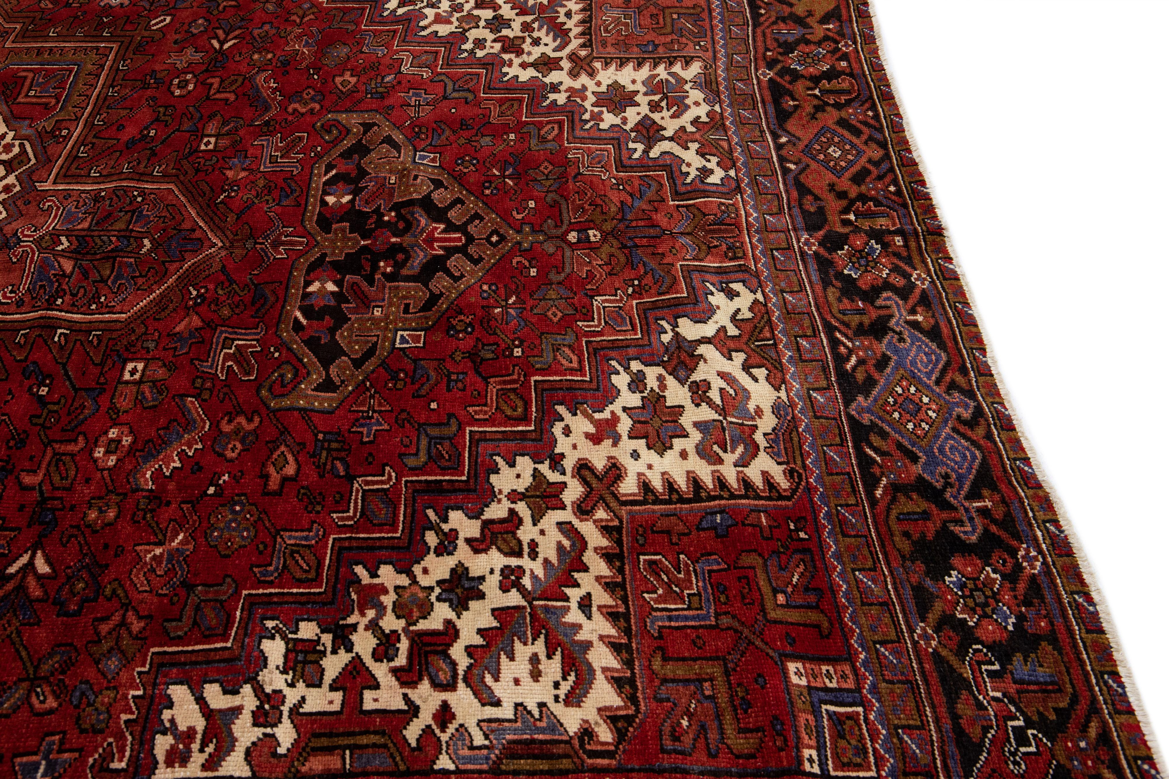 Antique Heriz Red Handmade Persian Wool Rug with Medallion Motif For Sale 1