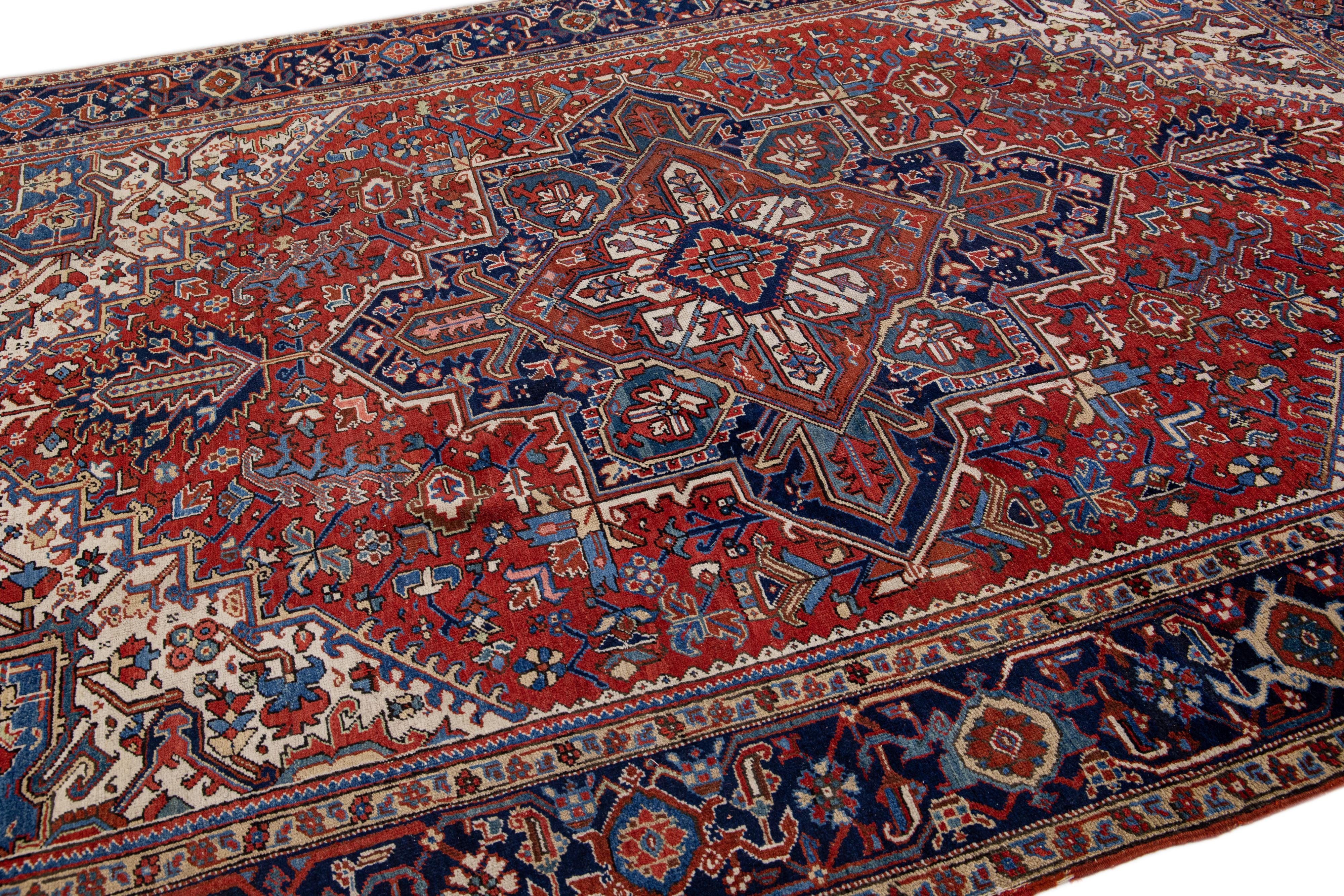 Hand-Knotted Antique Heriz Red Handmade Persian Wool Rug with Multicolor Medallion Design For Sale