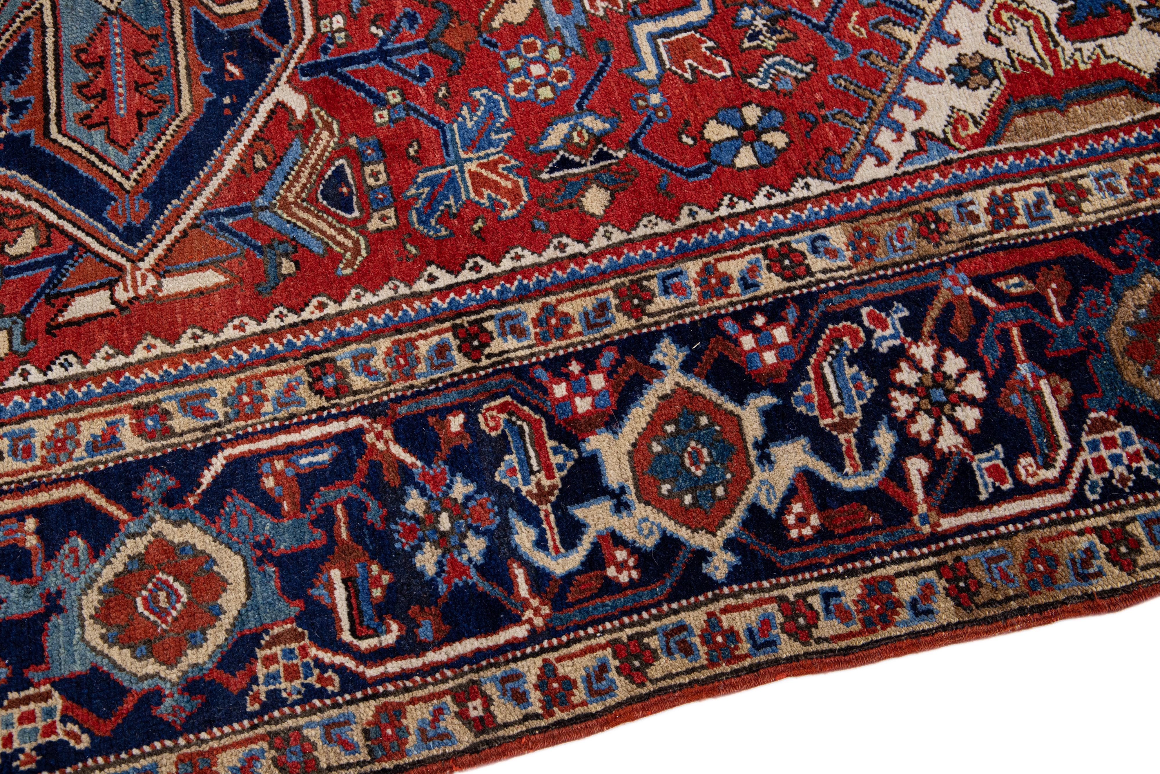 Antique Heriz Red Handmade Persian Wool Rug with Multicolor Medallion Design In Good Condition For Sale In Norwalk, CT