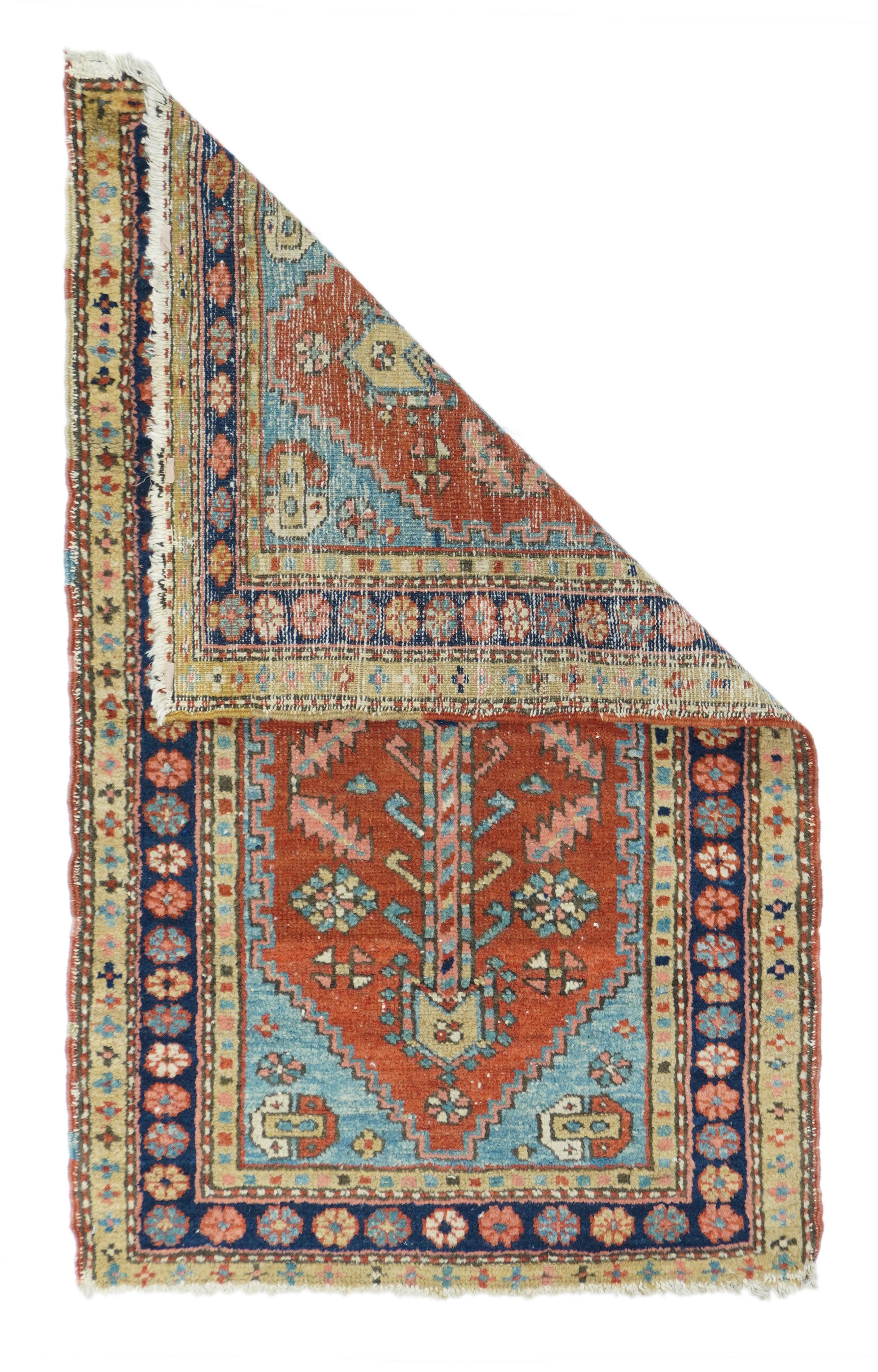 Antique Heriz Rug Measures : 2'6'' x 4'1''. The palette of larger Herizes is retained, but the pattern of this NW Persian village ruglet is switched to a small dark blue hexagon centre with four serrated leaves, and very long pendants. The madder