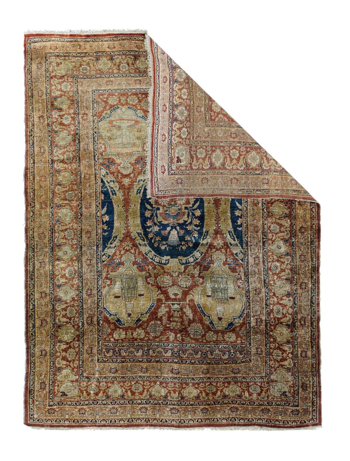 Antique Heriz rug measures 4'7'' x 6'1''.