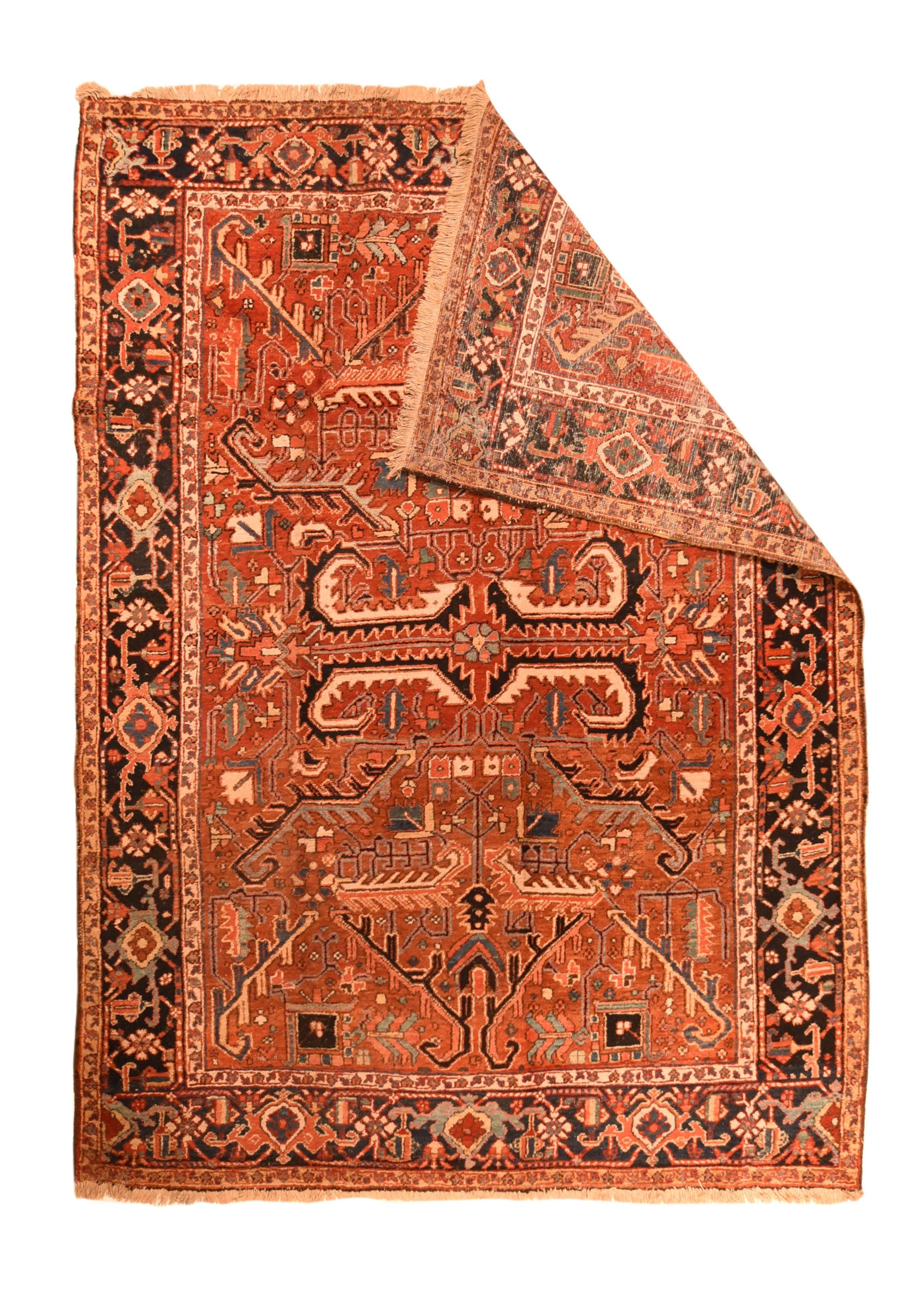 Antique Heriz Rug 6'8'' x 9'0''. Four giant, aggressive bitonal strongly curled leaves in charcoal and ecru give a serrated frame to a central petal rosette on the abrashed rust-red field. Big flanged bitonal leaves at each field end provide a bold