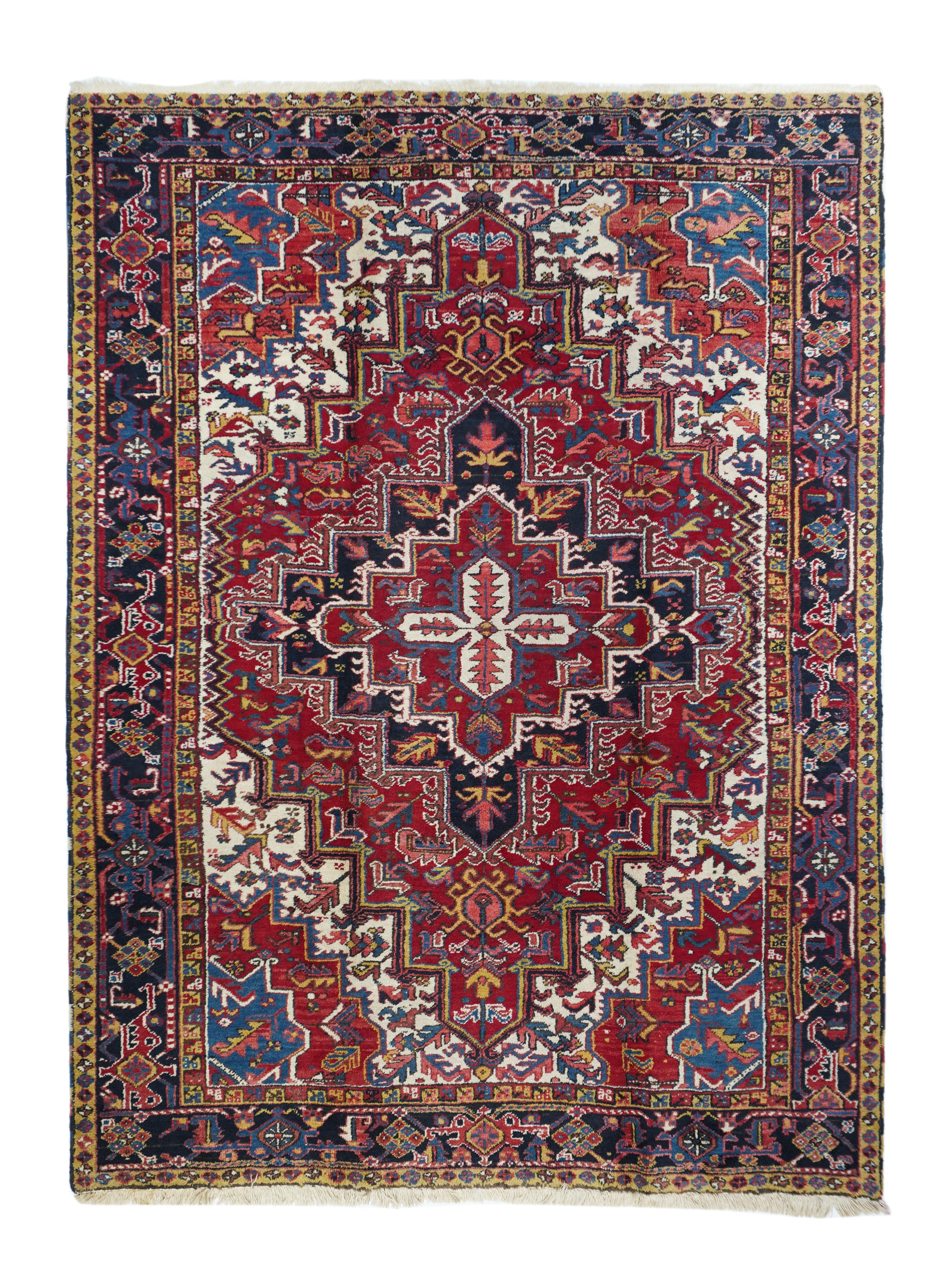 Antique Heriz rug 6'8'' x 9'4''. This attractive rustic NW Persian room size carpet displays a warm, clear madder red field supporting a version of the Mina Khani rosette trellis design., with two rosette styles, accented in light green, dark blue,