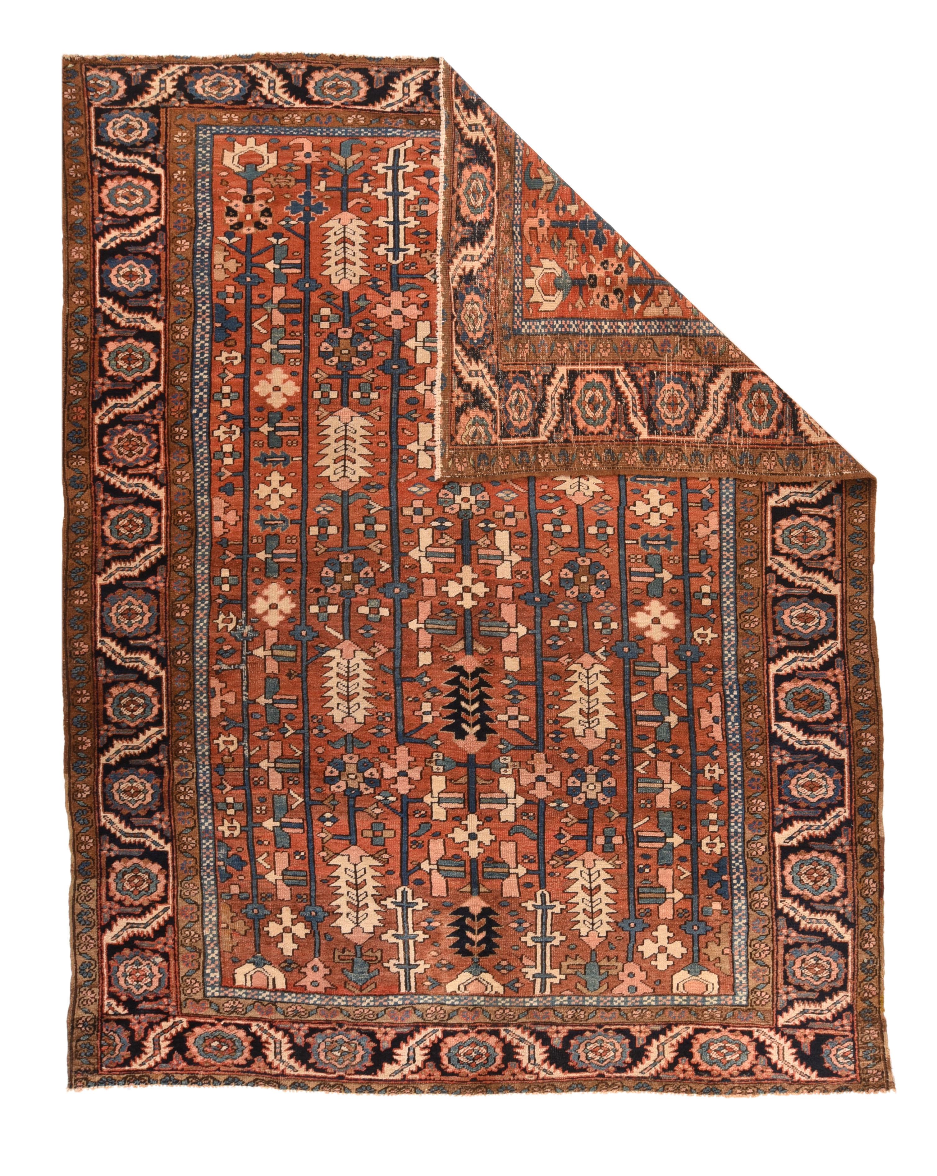 Antique Heriz Rug 8'6'' x 10'11''. Of moderately coarse weave on cotton, this semi-geometric rust-red ground village carpet features six full field length poles with pinecones, Maltese crosses and formal palmettes. Abrashed sapphire blue strip style