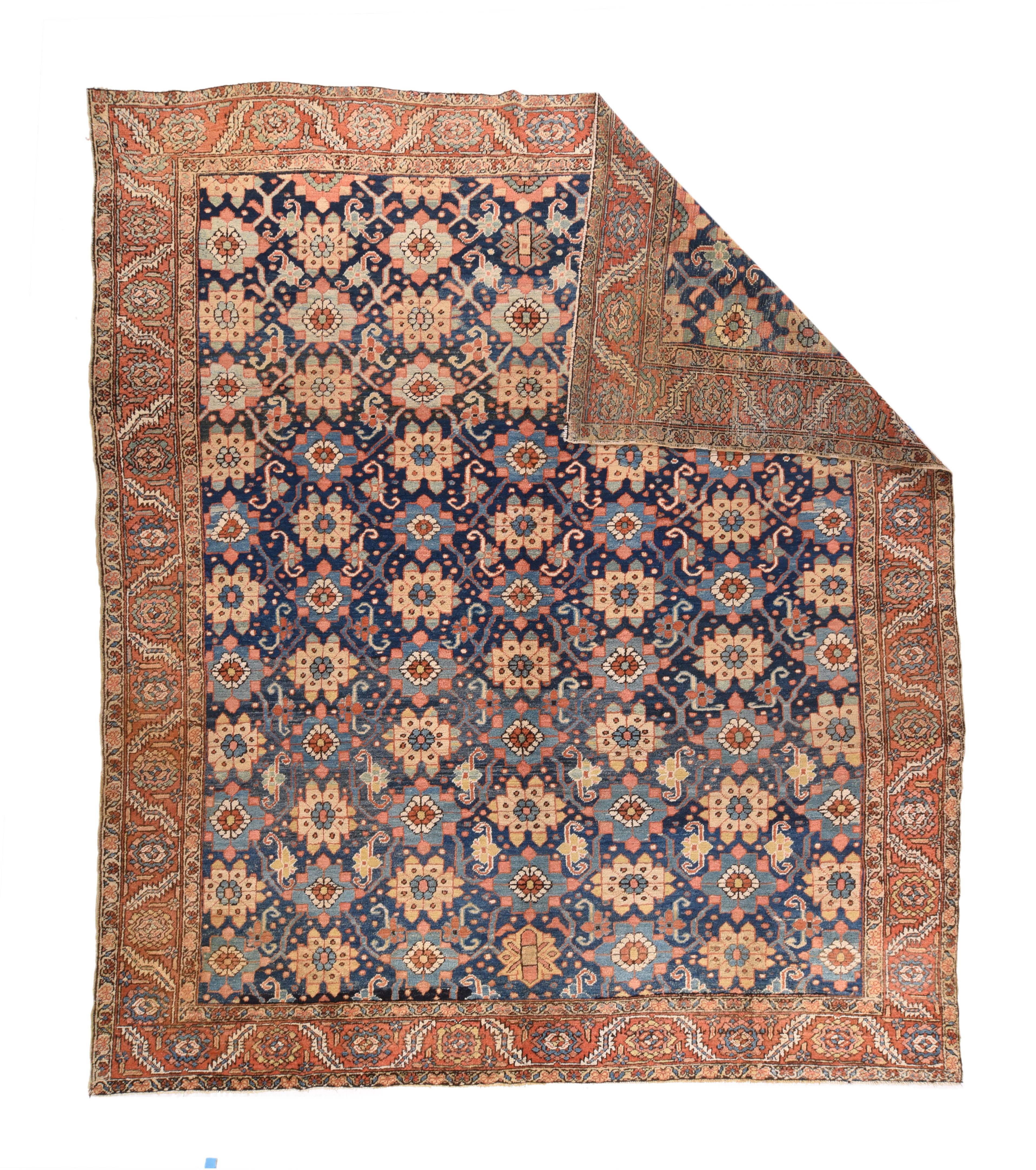 Antique Heriz Rug 9'10'' x 11'4''. The abrashed dark indigo field of this rustic Northwest Persian square carpet displays a modified Minsa Khani lattice of two rosette types, with lesser rosettes and small dots enlivening the ground. Rust strip