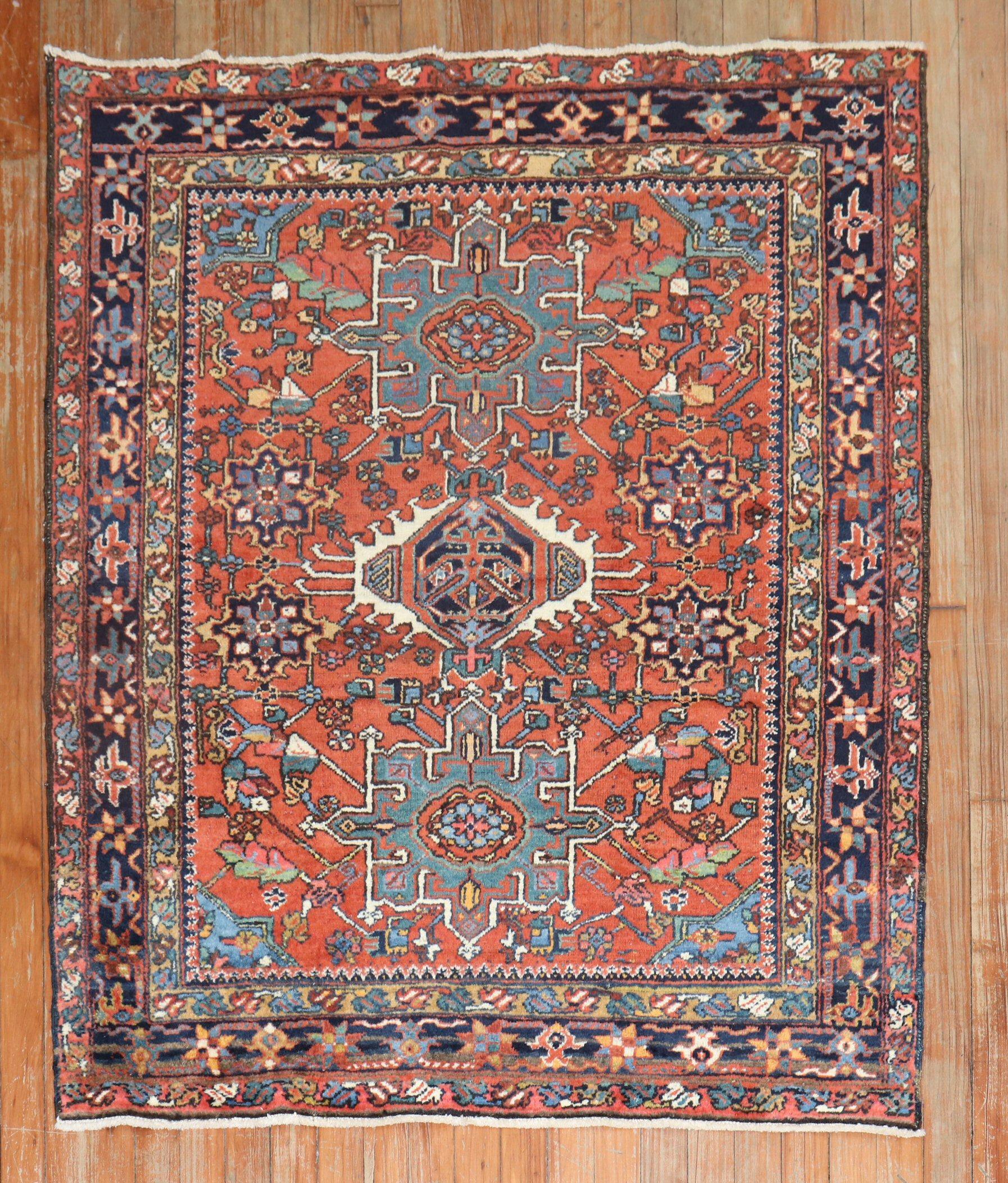 An early 20th Century Persian Heriz Karadja rug with traditional colors.

Measures: 3'8'' x 4'6''.