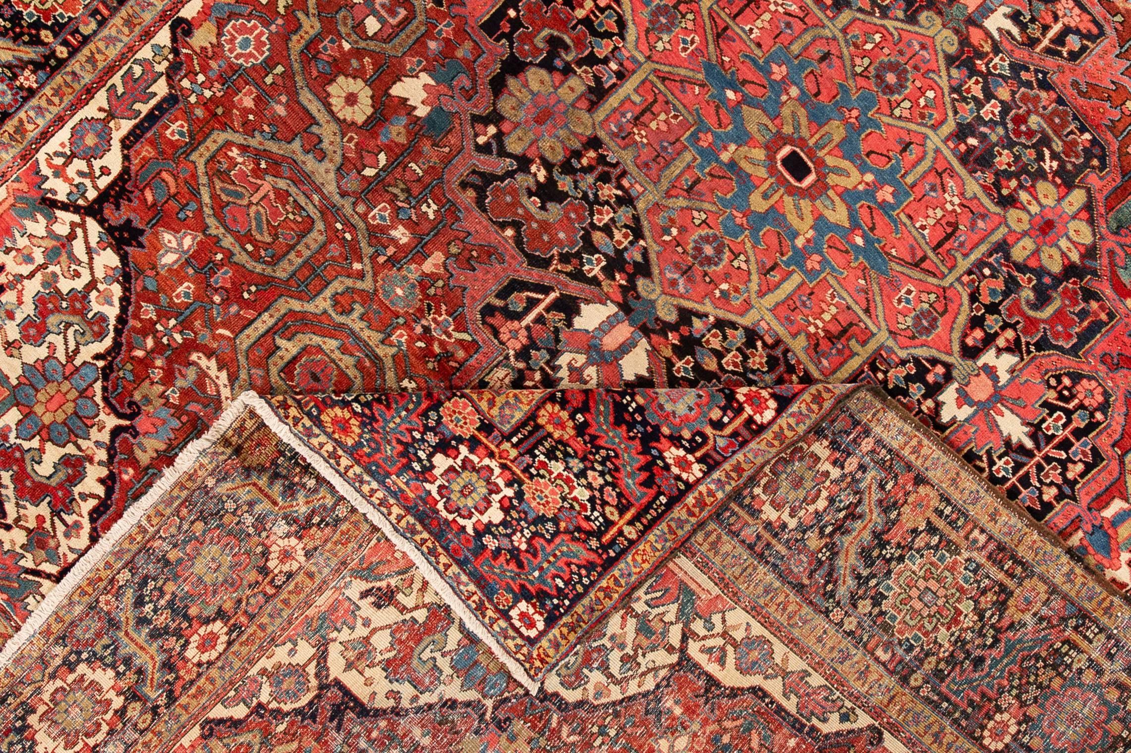Beautiful hand-knotted antique Heriz wool rug with a medallion geometric design on a rust field. 

This rug measures 9'10
