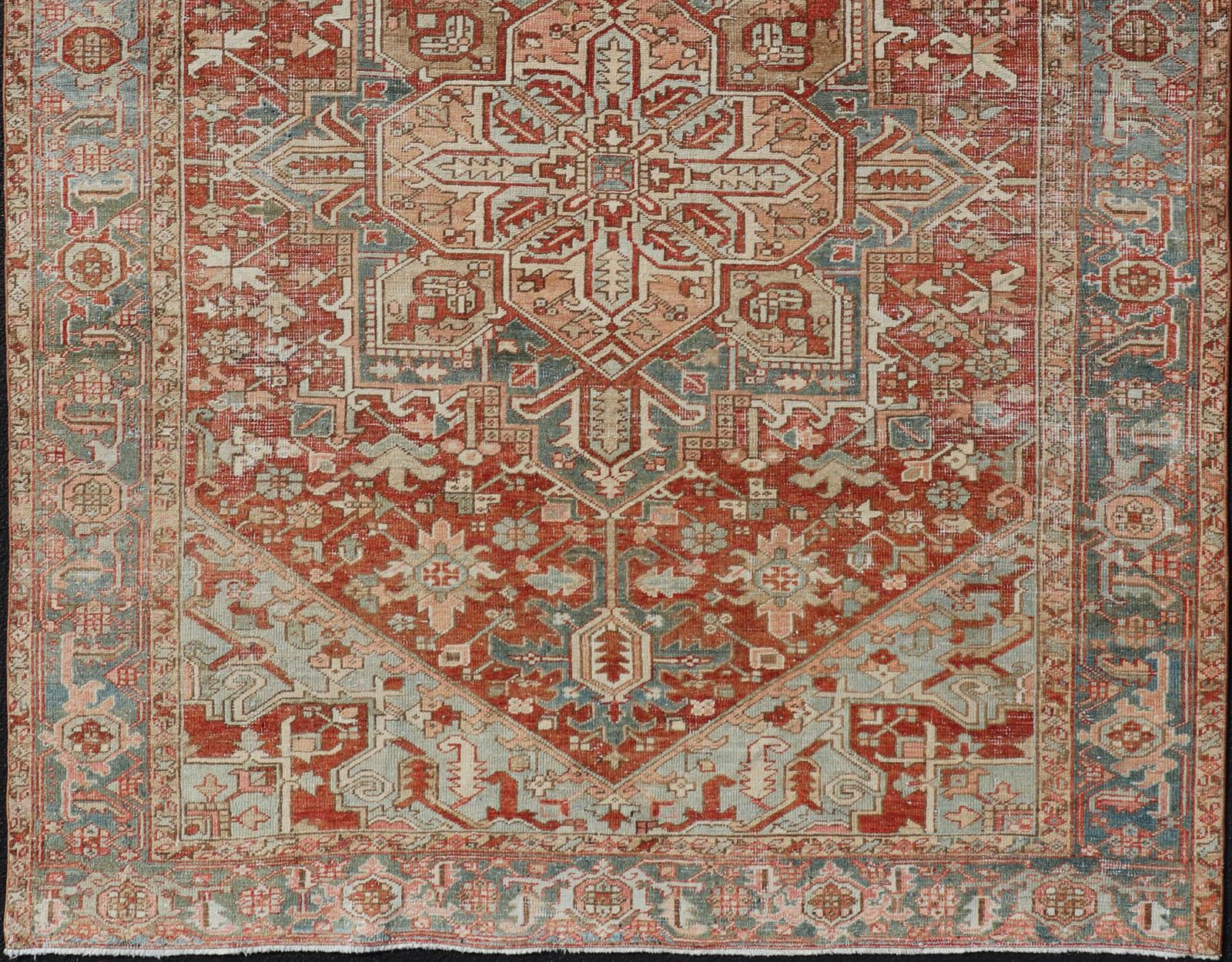 Antique Heriz Rug with All-Over Medallion Design in Red, Blue, Pink, Tan & Brown
Antique Heriz Rug, Keivan Woven Arts / rug EMB-9533-P13059, country of origin / type: Persian / Heriz, circa Early-20th Century.

Measures: 6'11 x 9'7.