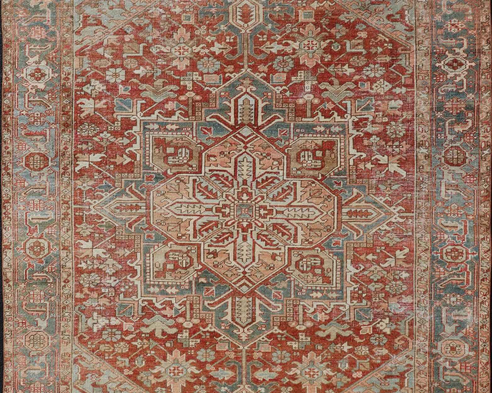 Persian Antique Heriz Rug with All-Over Medallion Design in Red, Blue, Pink, Tan & Brown For Sale