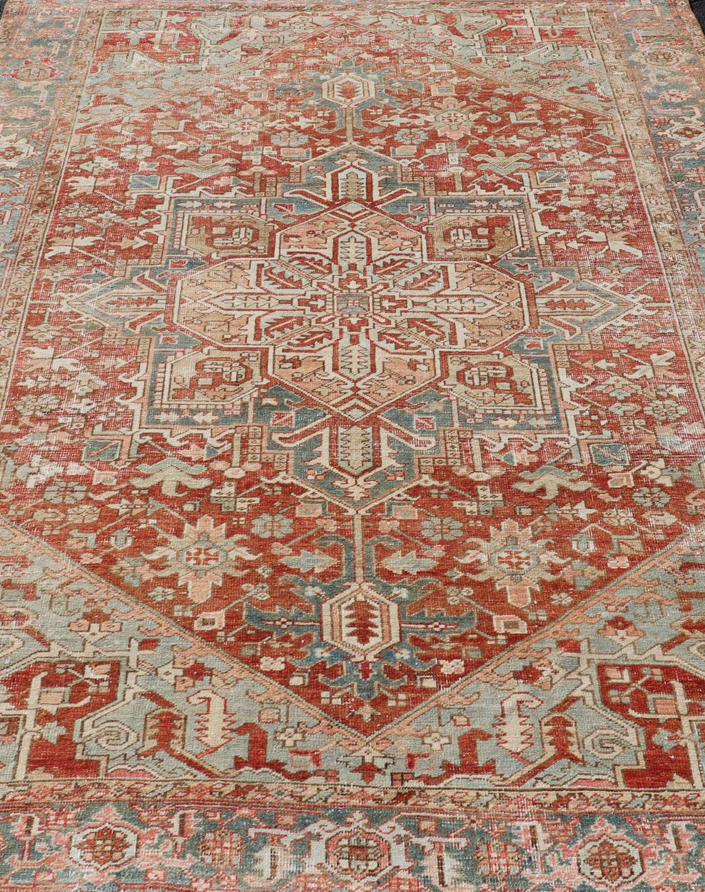 Antique Heriz Rug with All-Over Medallion Design in Red, Blue, Pink, Tan & Brown In Good Condition For Sale In Atlanta, GA