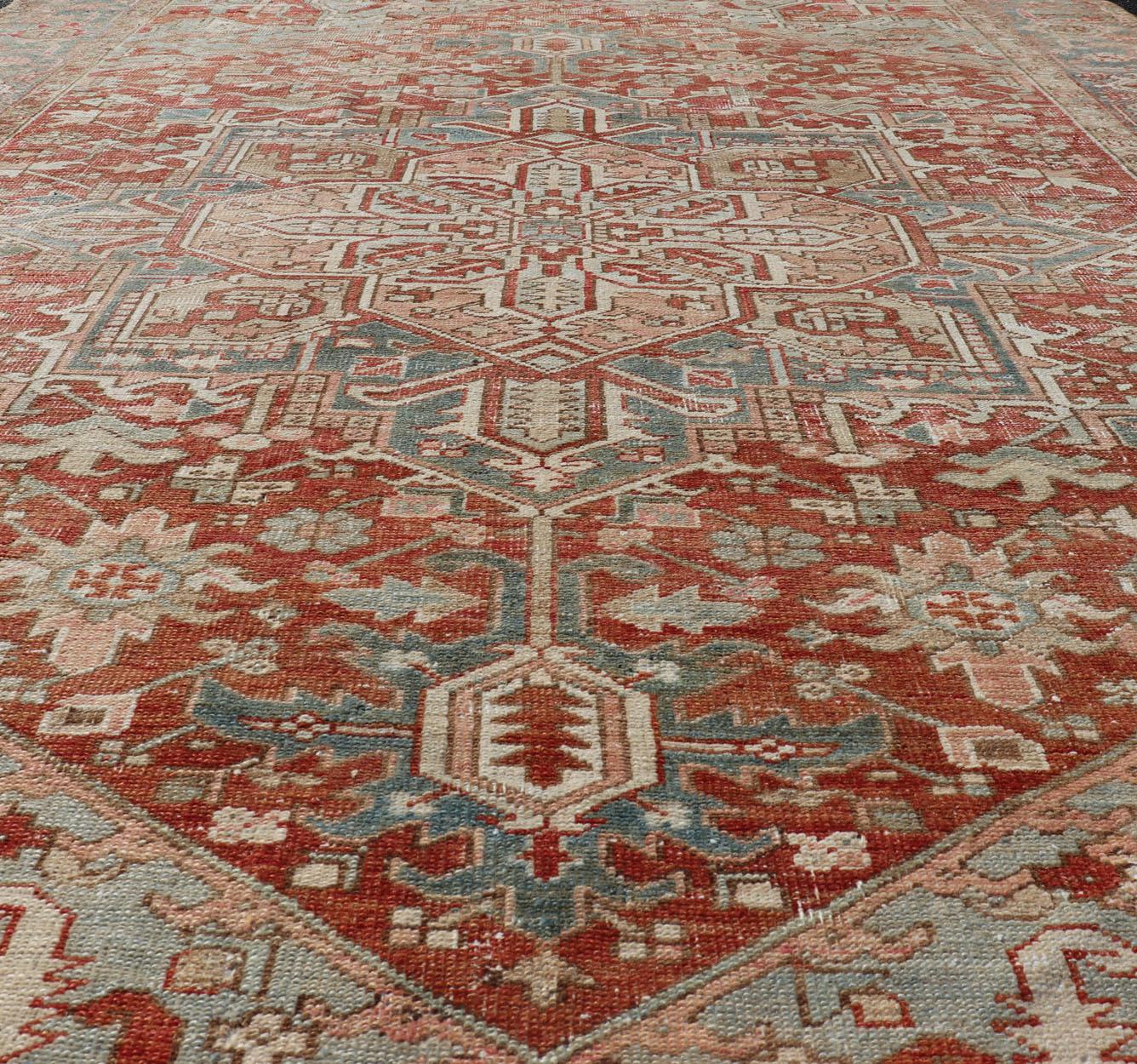 20th Century Antique Heriz Rug with All-Over Medallion Design in Red, Blue, Pink, Tan & Brown For Sale