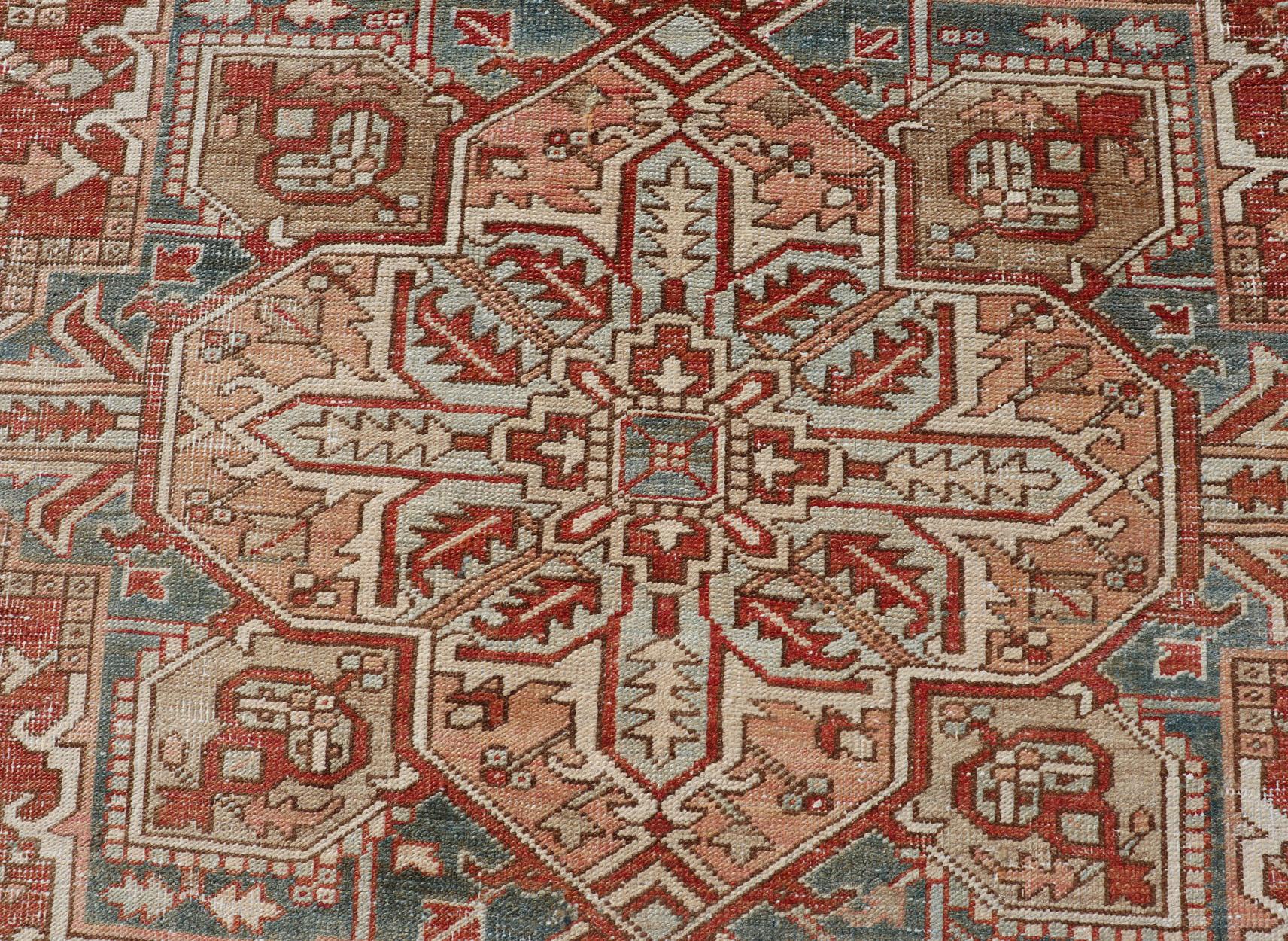Wool Antique Heriz Rug with All-Over Medallion Design in Red, Blue, Pink, Tan & Brown For Sale