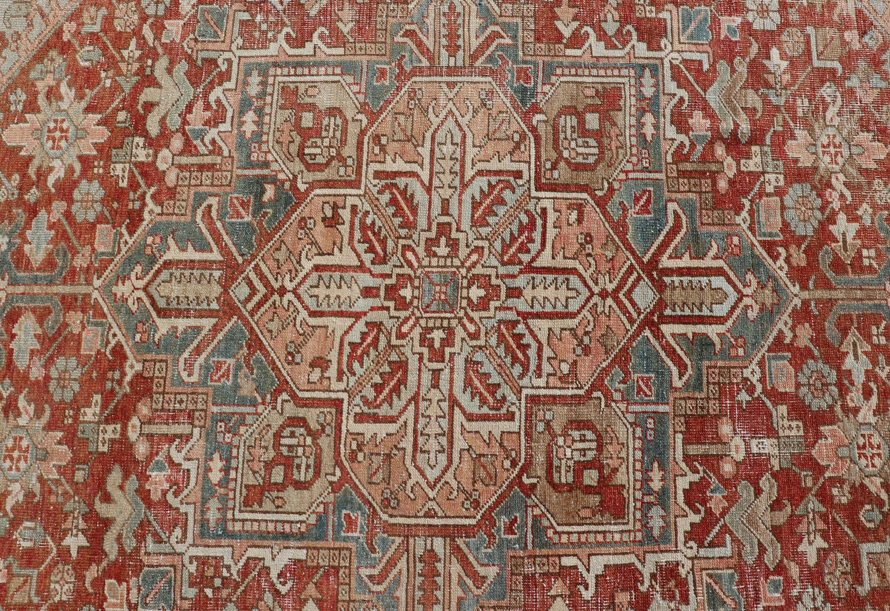 Antique Heriz Rug with All-Over Medallion Design in Red, Blue, Pink, Tan & Brown For Sale 1
