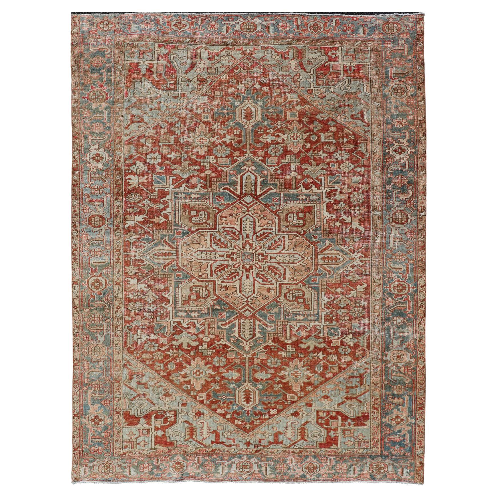 Antique Heriz Rug with All-Over Medallion Design in Red, Blue, Pink, Tan & Brown For Sale