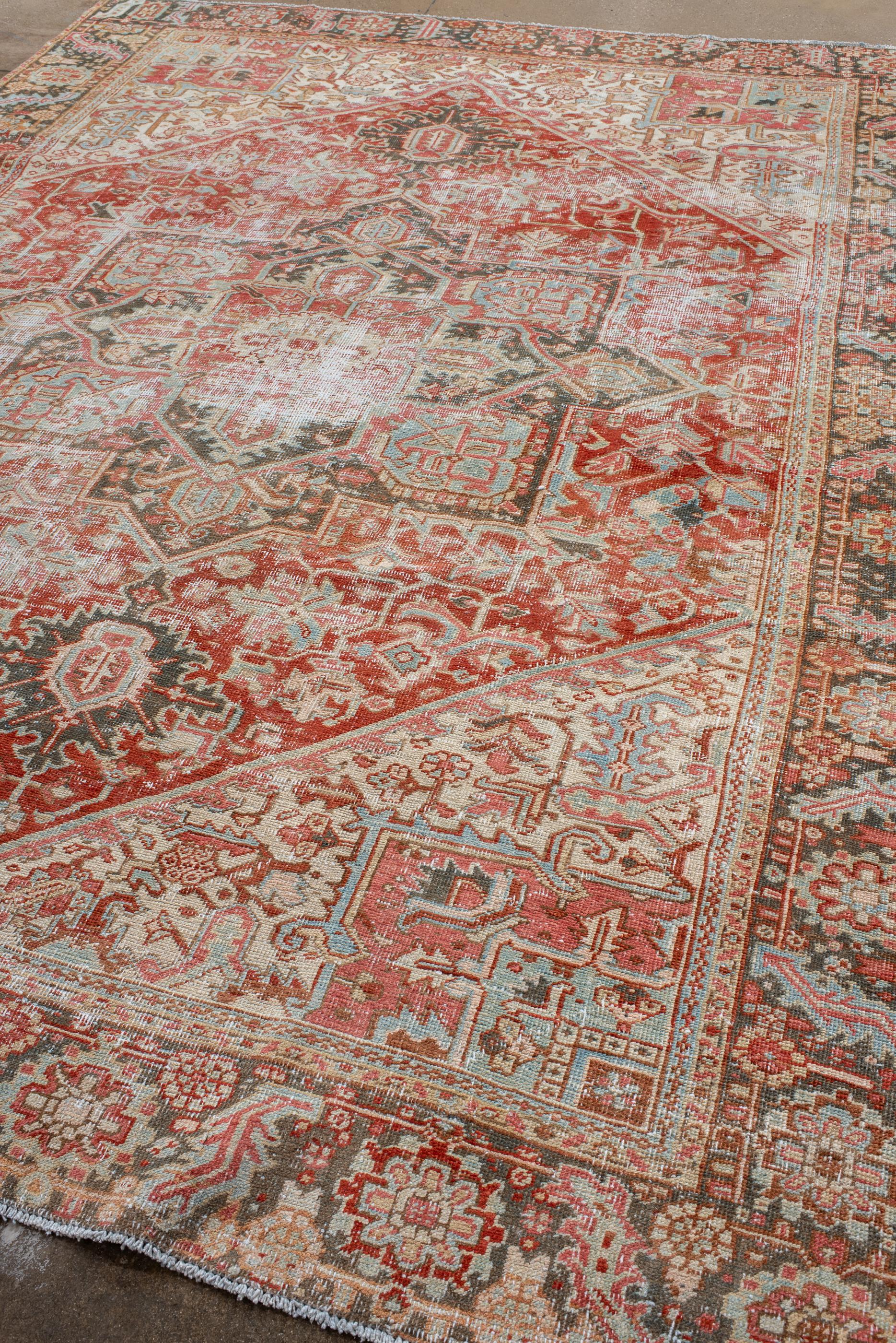 Persian Antique Heriz Rug with Bold Medallion, Early 20th Century For Sale