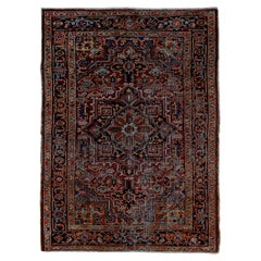 Antique Heriz Rug with Red Field and blue Medallion 