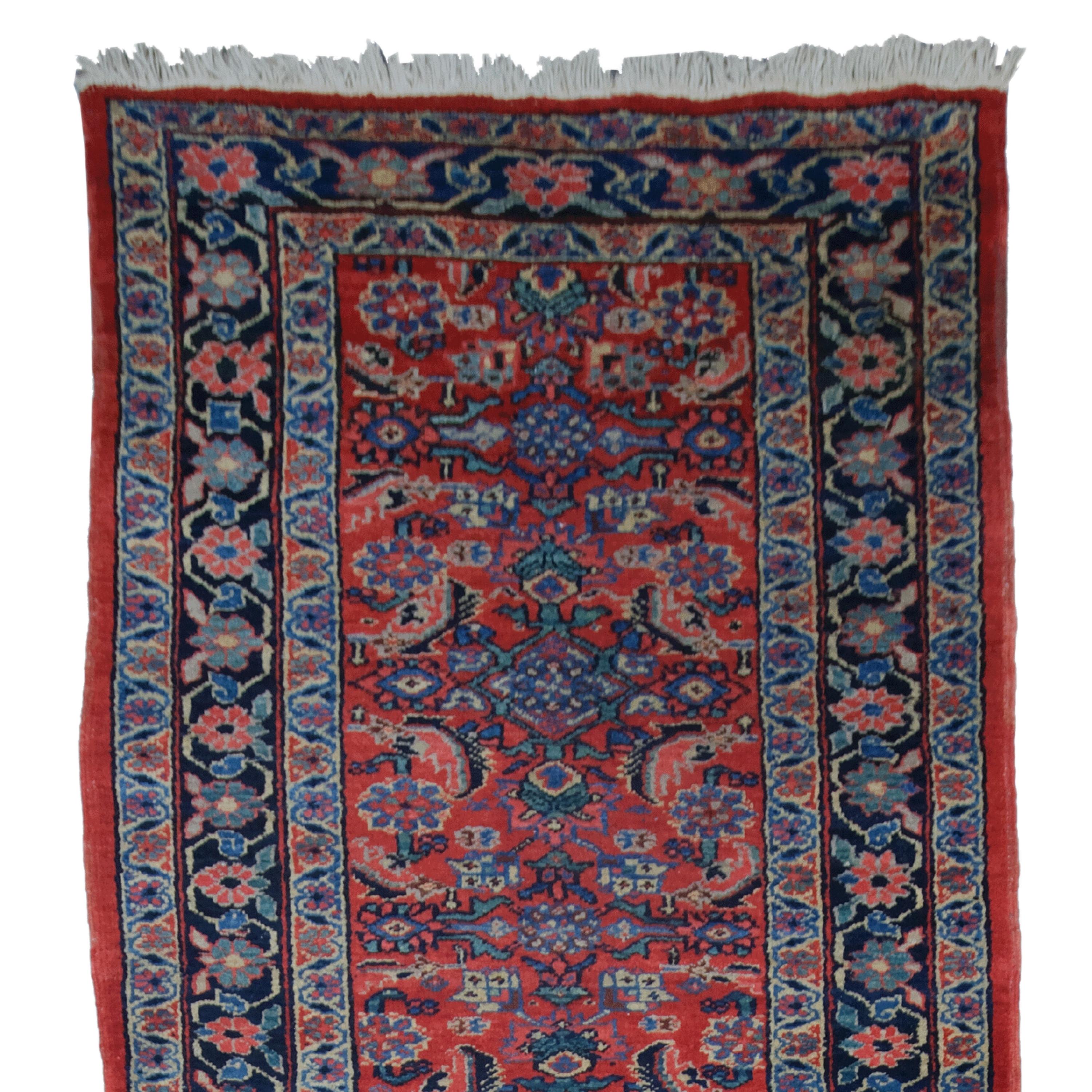 We offer a magnificent 19th century antique Heriz runner woven with historical richness and artistic skill. With its intricate patterns and vibrant colors, this runner is not just a carpet, but a work of art that adds warmth and style to any