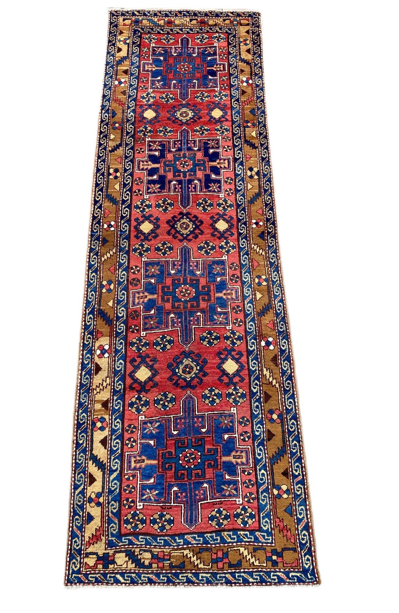 A lovely antique Heriz runner, handwoven circa 1910 with a 4 medallion geometrical design on a terracotta red field and unusual camel border. Lovely wool quality and fabulous secondary colours.
Size: 3.28m x 0.98m (10ft 10in x 3ft 3in)
This rug is