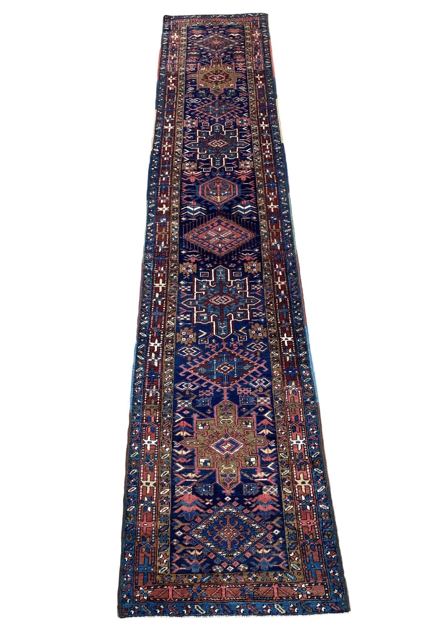 A fabulous antique Heriz runner, handwoven in circa 1900 with a geometrical design on a dark indigo field and terracotta border. Full of rustic charm and great secondary colours.
Size: 4.27m x 0.90m (14ft x 3ft)
This rug is in good condition with