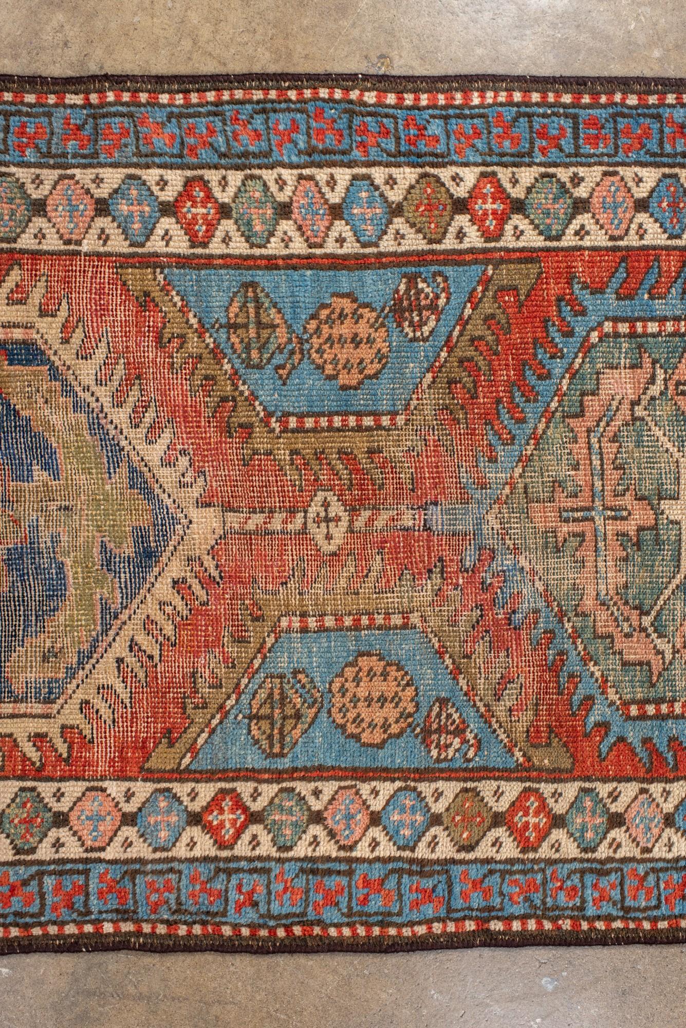20th Century Antique Heriz Runner with Hexagonal Medallions in Red and Blue For Sale
