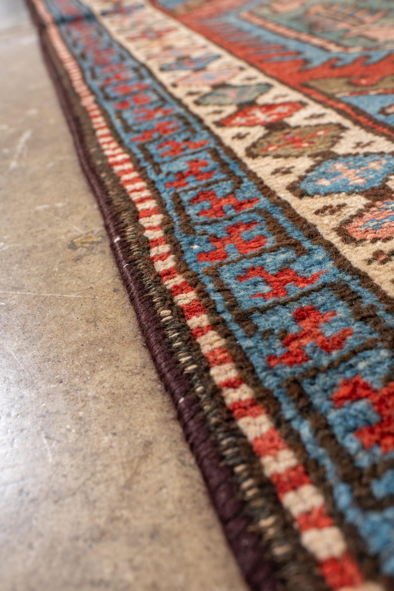 Wool Antique Heriz Runner with Hexagonal Medallions in Red and Blue For Sale
