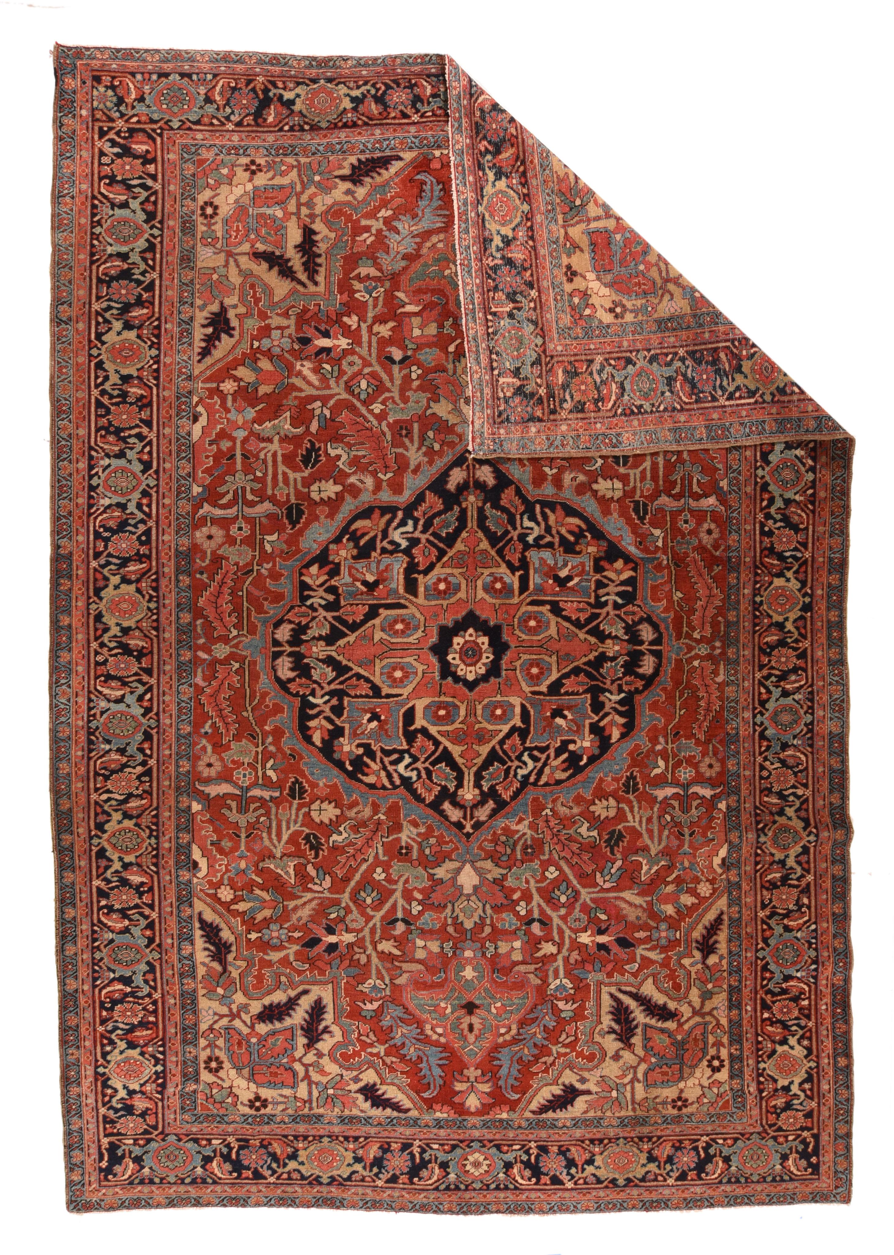 Antique Heriz Serapi rug 8'9'' x 12'6''. Classically Heriz, with a shaped and pointed navy medallion centred by a rose concave diamond, on a natural madder red field displaying chunky vinery and imaginative flowers, and detached escutcheon pendants.