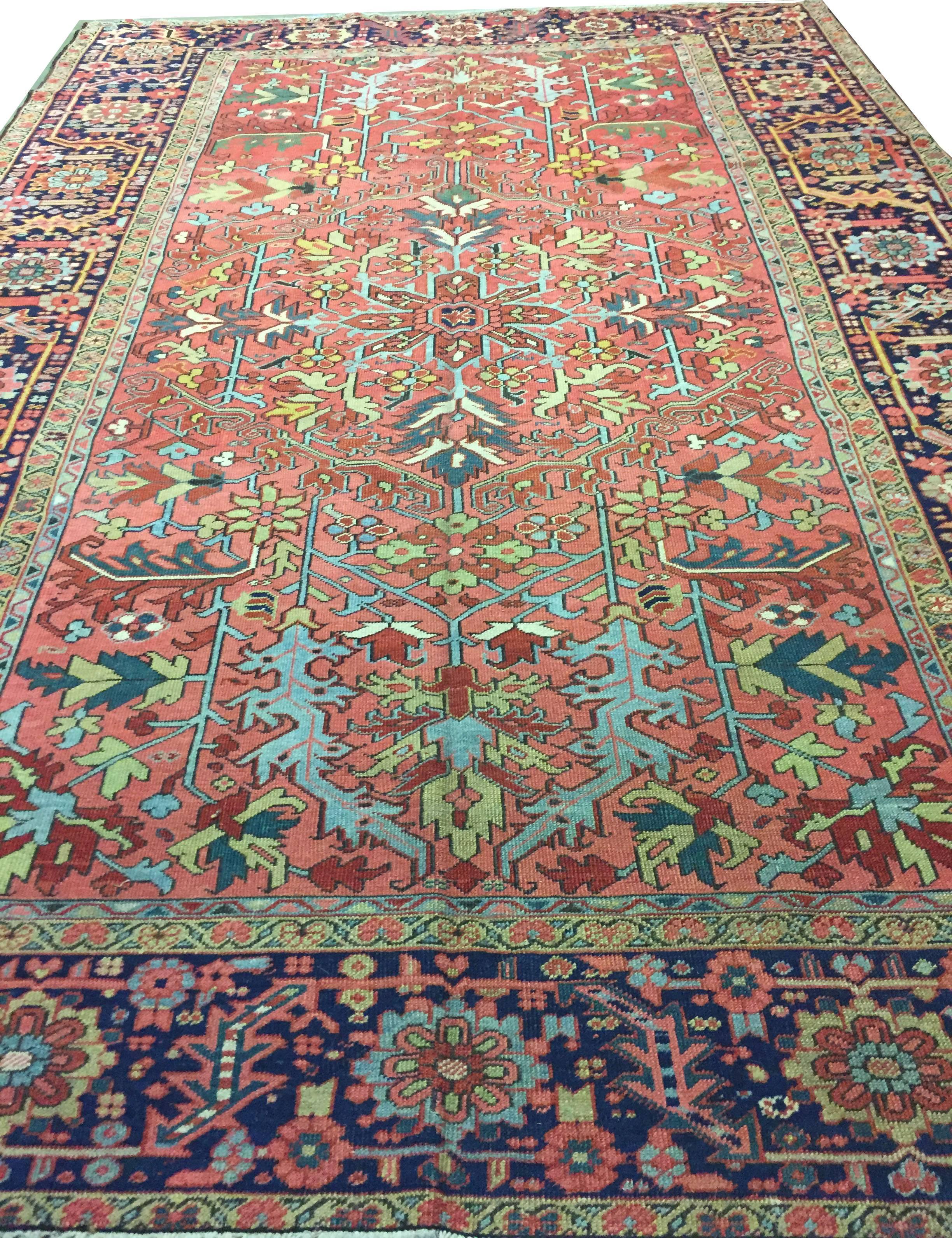 Antique Heriz Serapi rug, circa 1890. This antique Persian Heriz Serapi rug has a wonderful soft and relaxing central field enclosed by a striking main border filled with floral elements. The rug is in very good condition with a low pile that adds