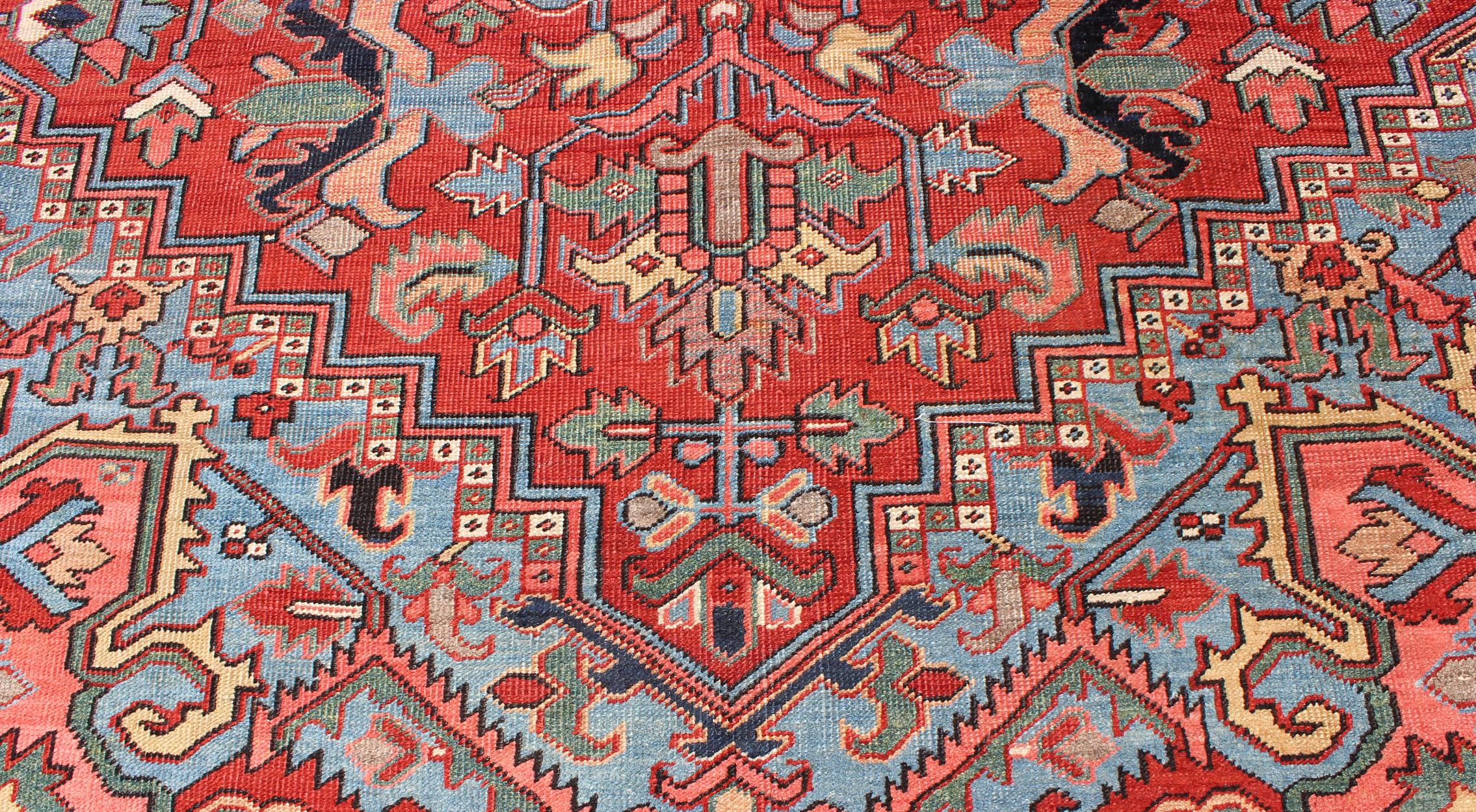 Wool Antique Persian Heriz Serapi Rug with Central Medallion and Geometric Design For Sale