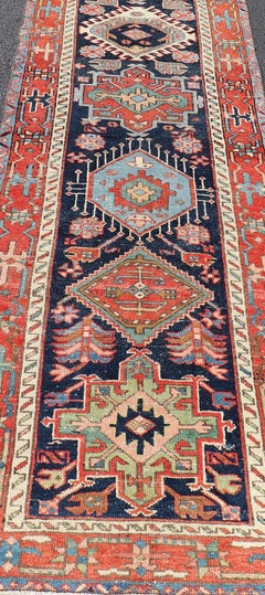 Antique Heriz Serapi Runner with Colorful Highly Stylized Medallion Design
