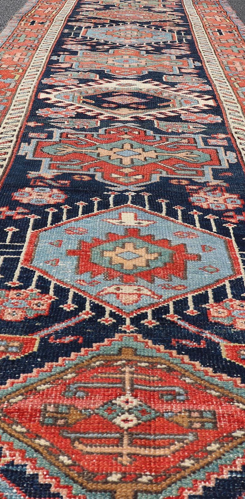 Persian Antique Heriz Serapi Runner with Colorful Highly Stylized Medallion Design For Sale