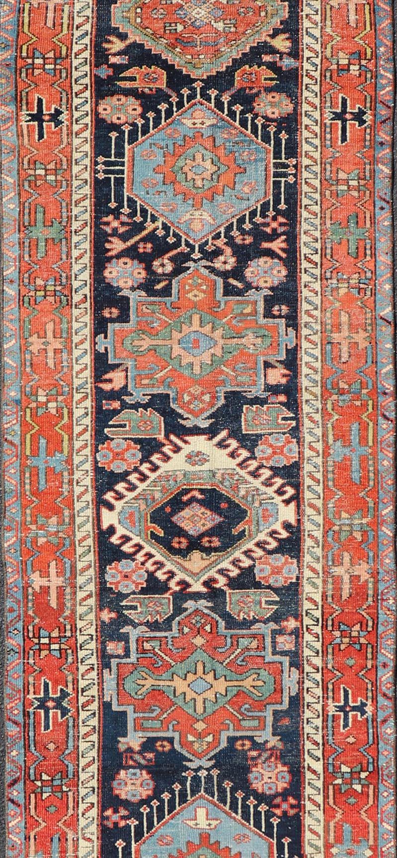 Wool Antique Heriz Serapi Runner with Colorful Highly Stylized Medallion Design For Sale