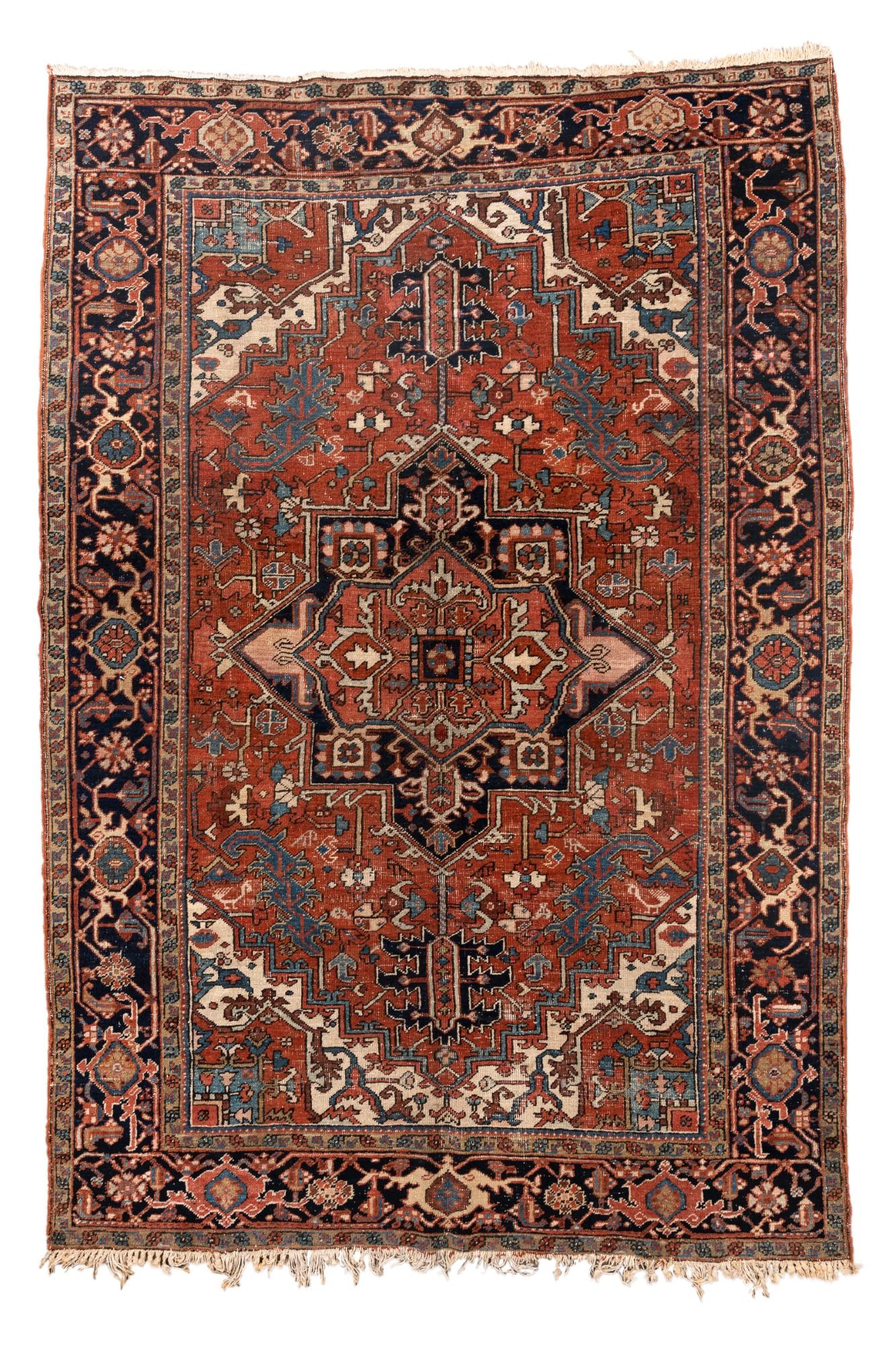 This antique Heriz rug, measuring 6'8