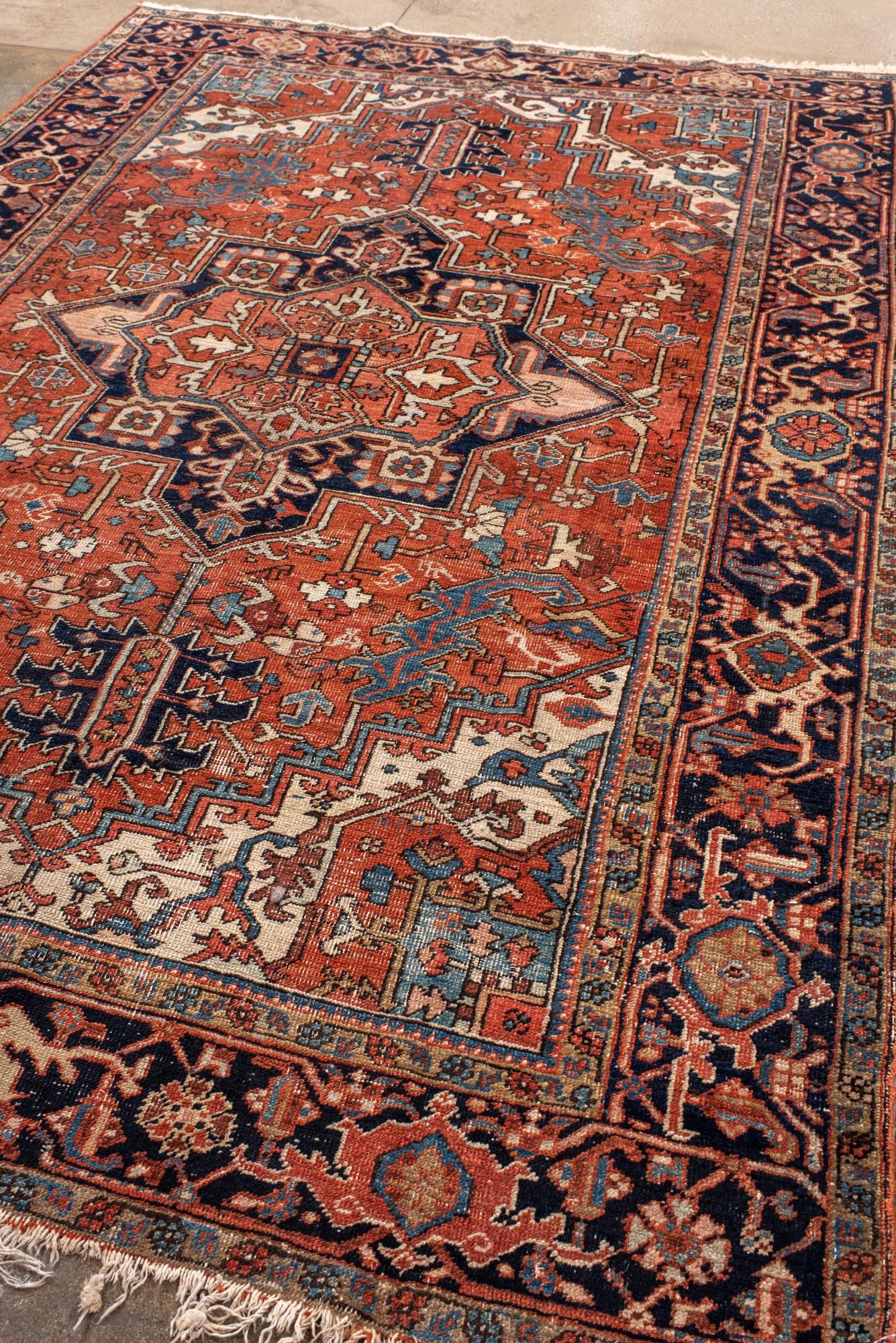 Persian Antique Heriz with Dramatic Medallion and Deep Indigo Border For Sale