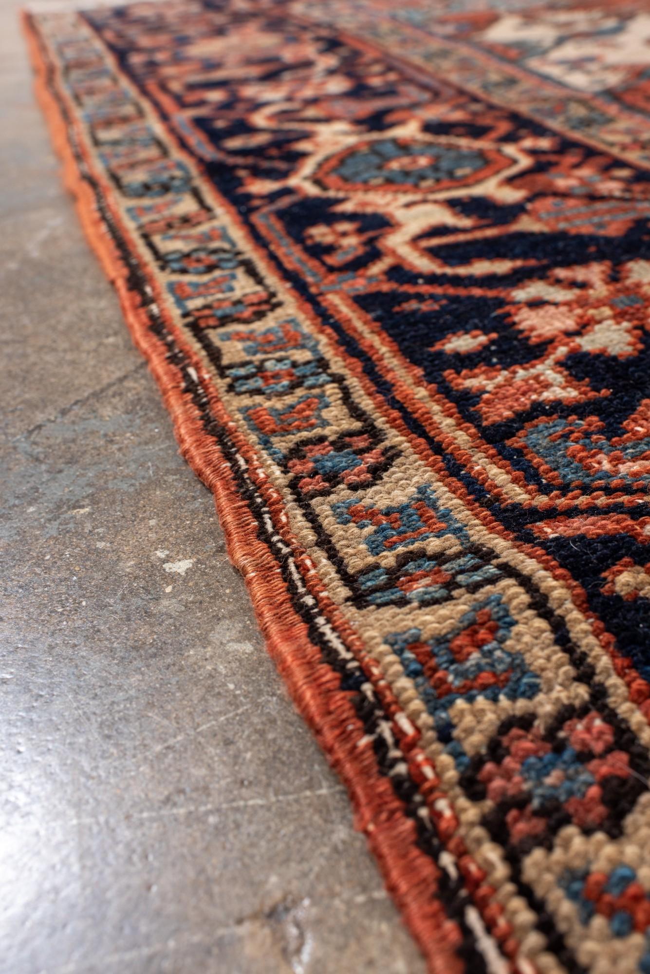 Wool Antique Heriz with Dramatic Medallion and Deep Indigo Border For Sale