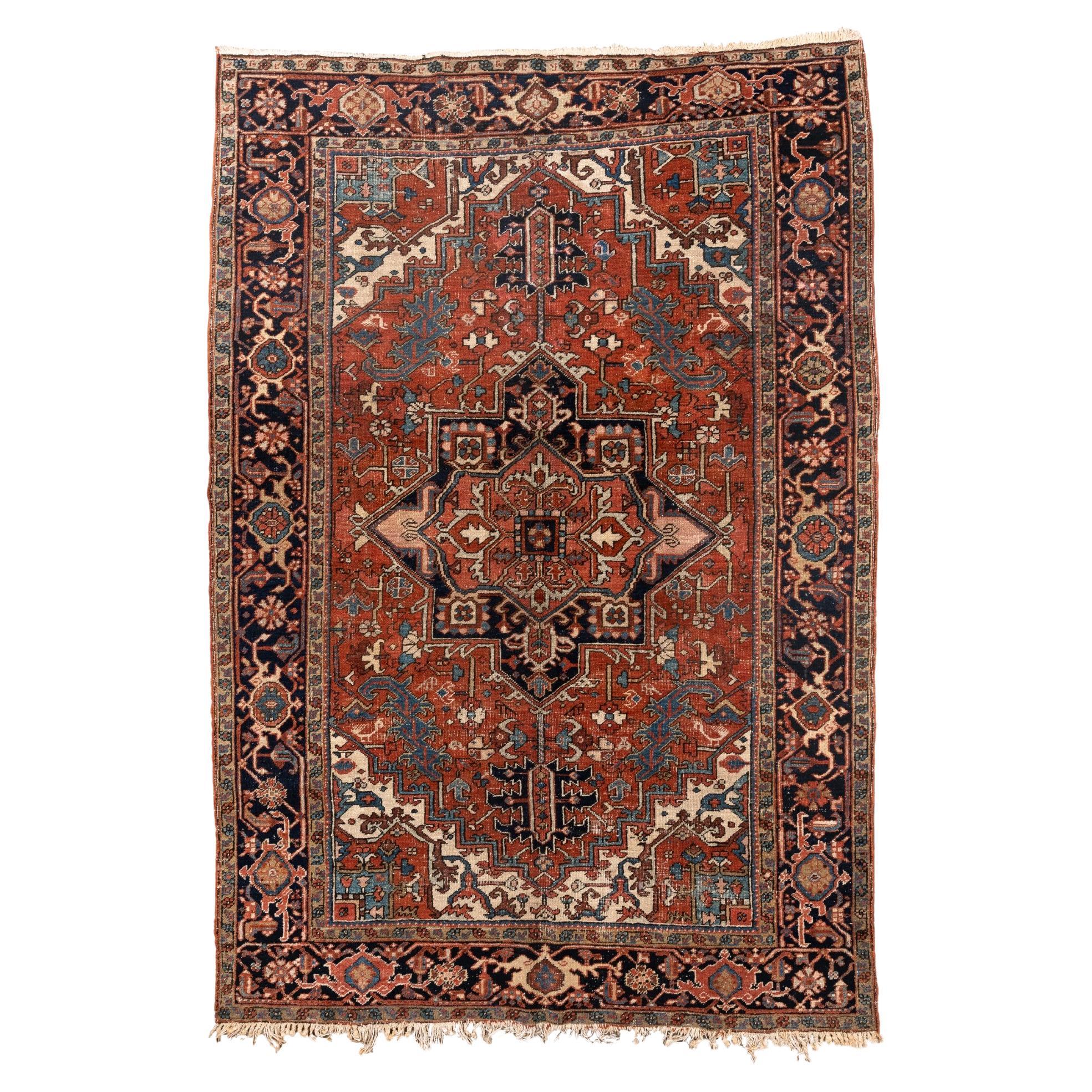 Antique Heriz with Dramatic Medallion and Deep Indigo Border For Sale