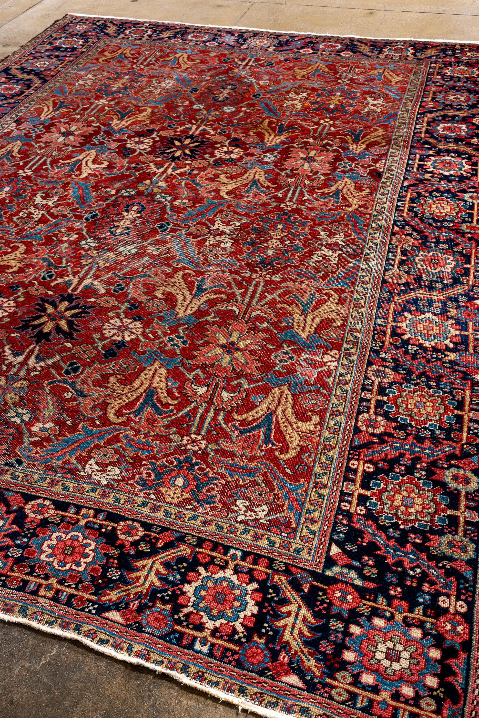 Persian Antique Heriz with Red Field and Rosette Border For Sale