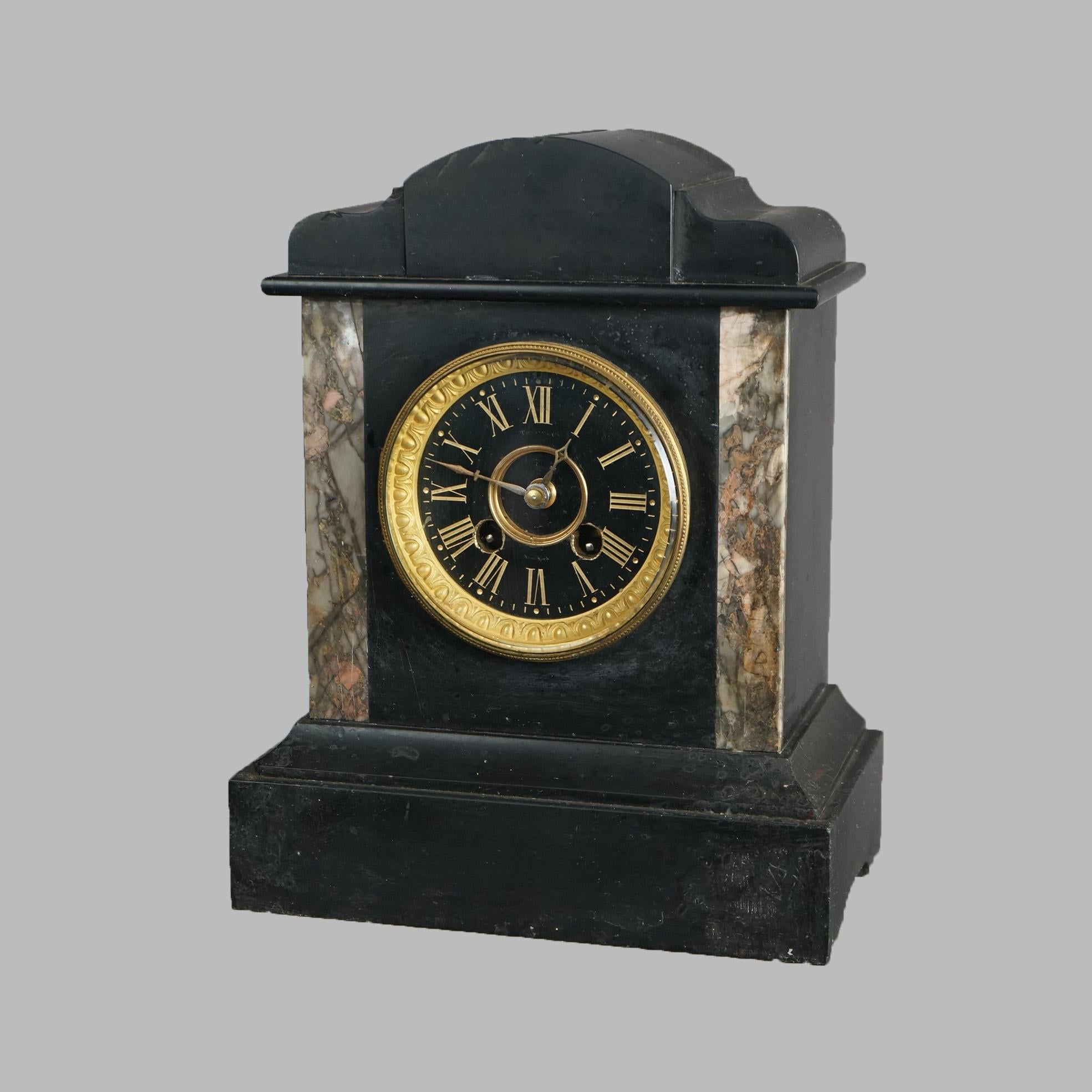 An antique Egyptian Revival mantel clock by Herschede offers slate case in architectural form and having marble facing, maker mark as photographed, c1890

Measures- 11.5''H x 9.25''W x 5.5''D