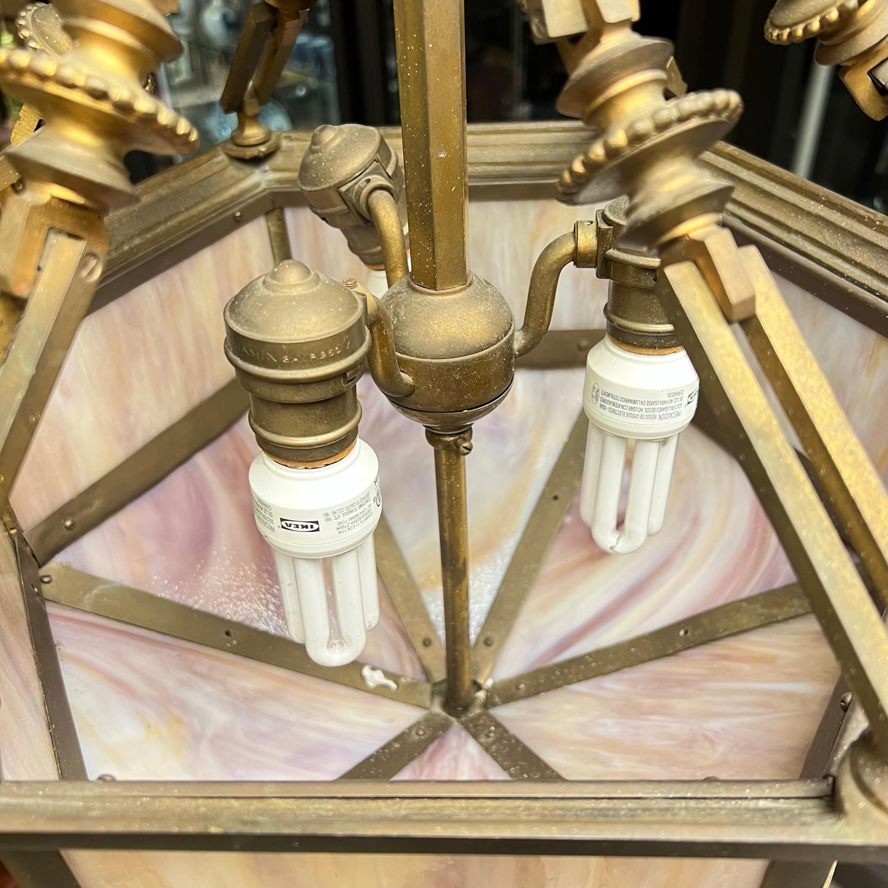 Very fine quality French  hanging lamp in the Arts and Crafts style with hexagonal shape and slag glass in shades of pink.  With three working sockets and wiring, ready for use.