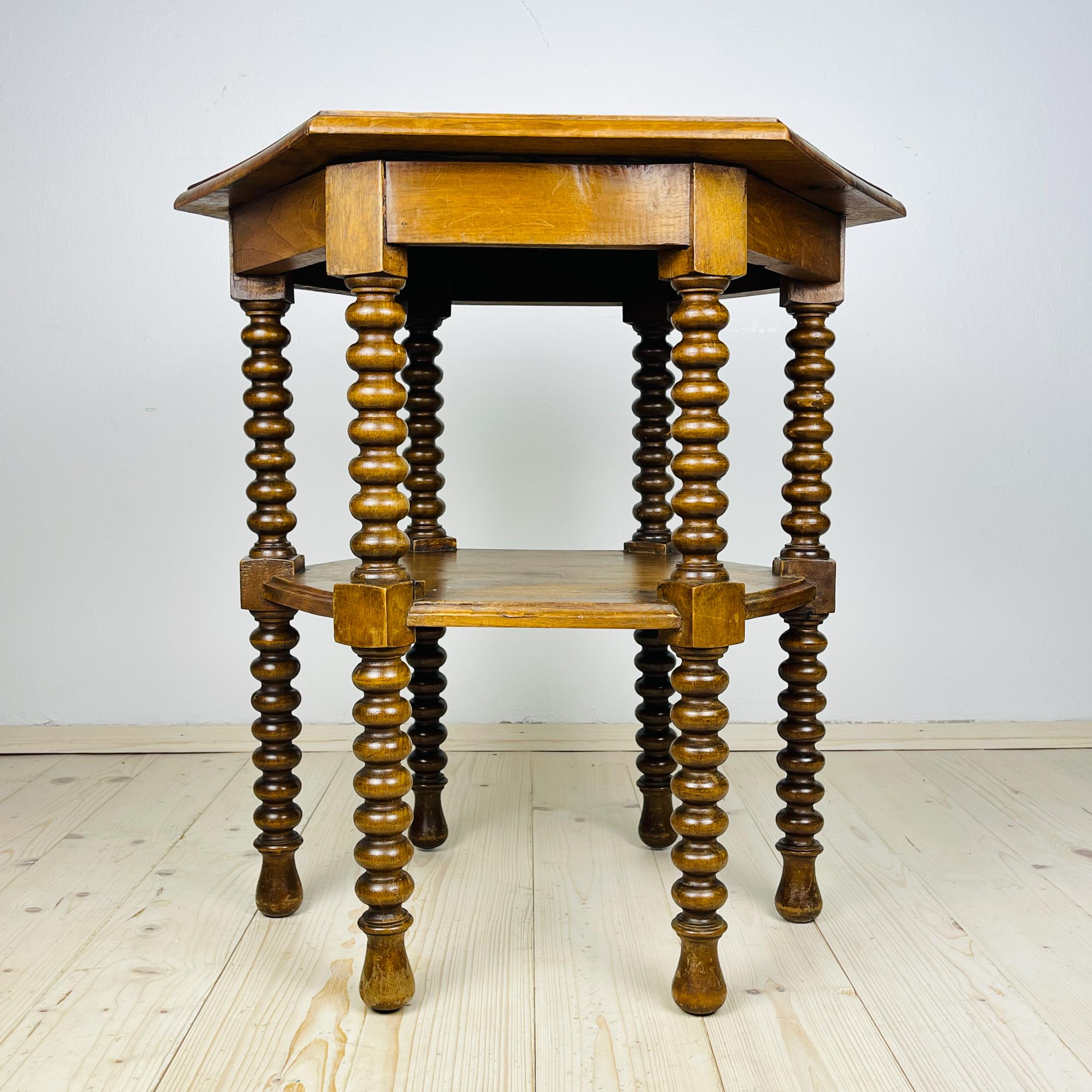 Beautiful antique Italian solid walnut side table, features a hexagonal top with beveled edges over six beautifully bobbin turned legs, connected to one another in a central shelve.
Made in Italy, early 20th Century.
This is a rare find. Such tables