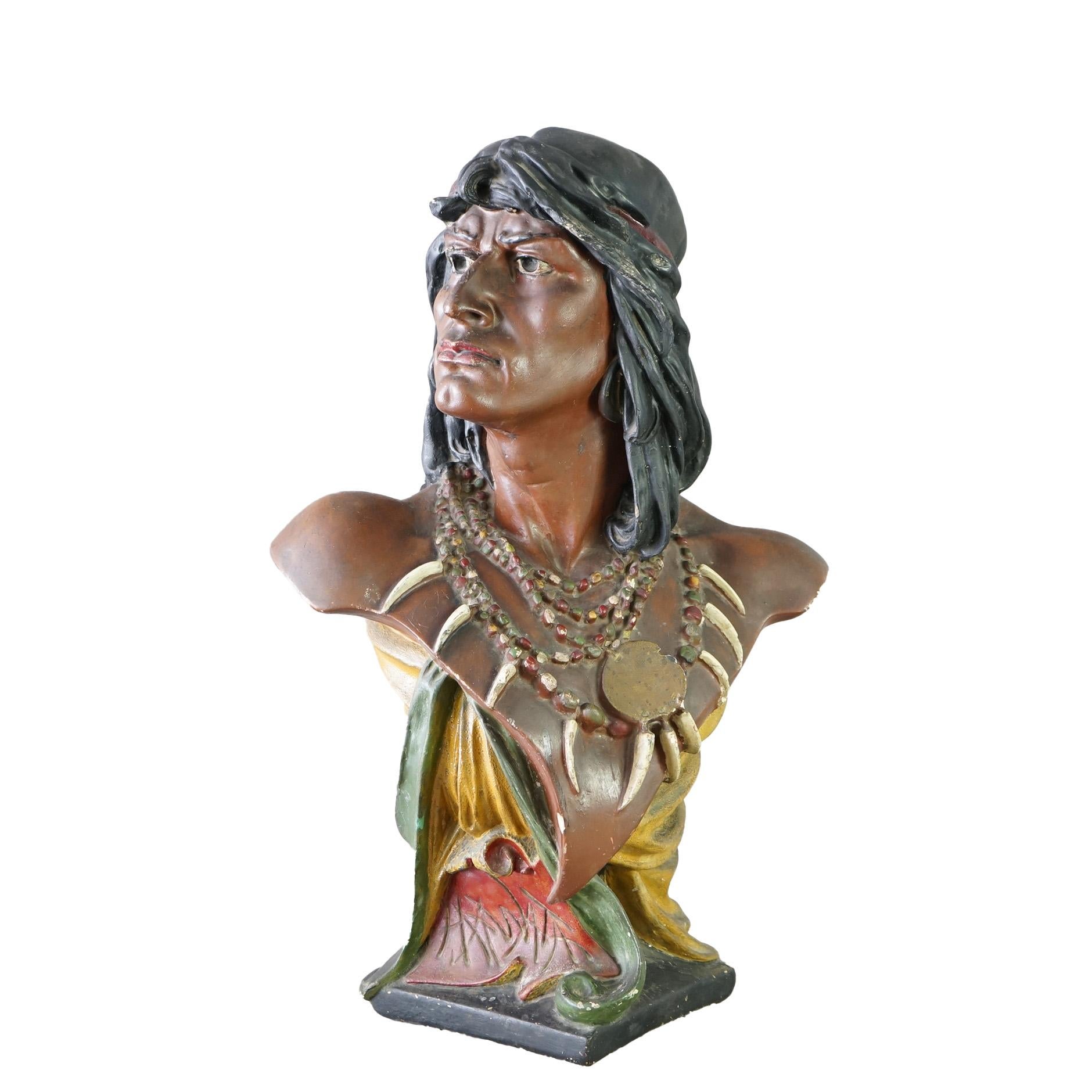 An antique Hiawatha cigar store portrait bust offers polychrome chalkware construction in the form of an American Indian warrior, c1900

Measures - 28.5