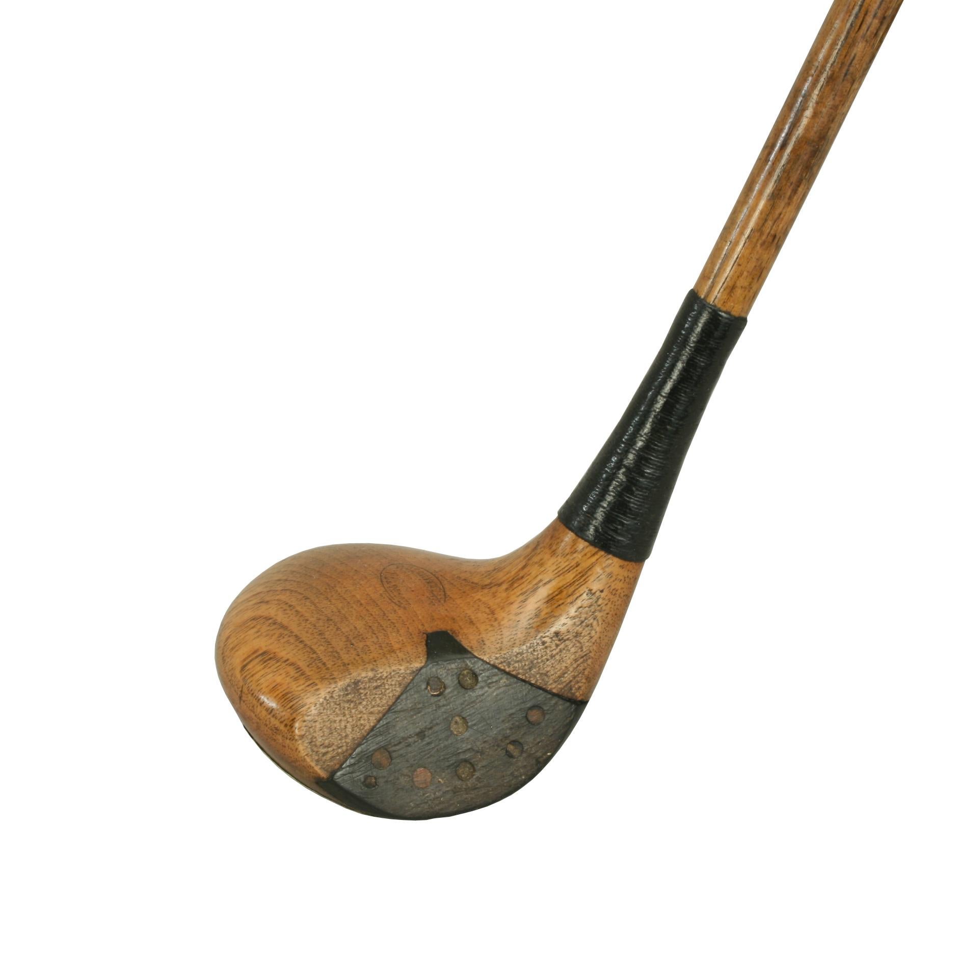 Antique Hickory Golf Club, Brassie.
A beautiful persimmon wood Brassie with hickory shaft. The club head is with full brass sole plate, fibre face insert with wooden pegs and lead weight to the rear. The head has an approximate 21° loft. The makers