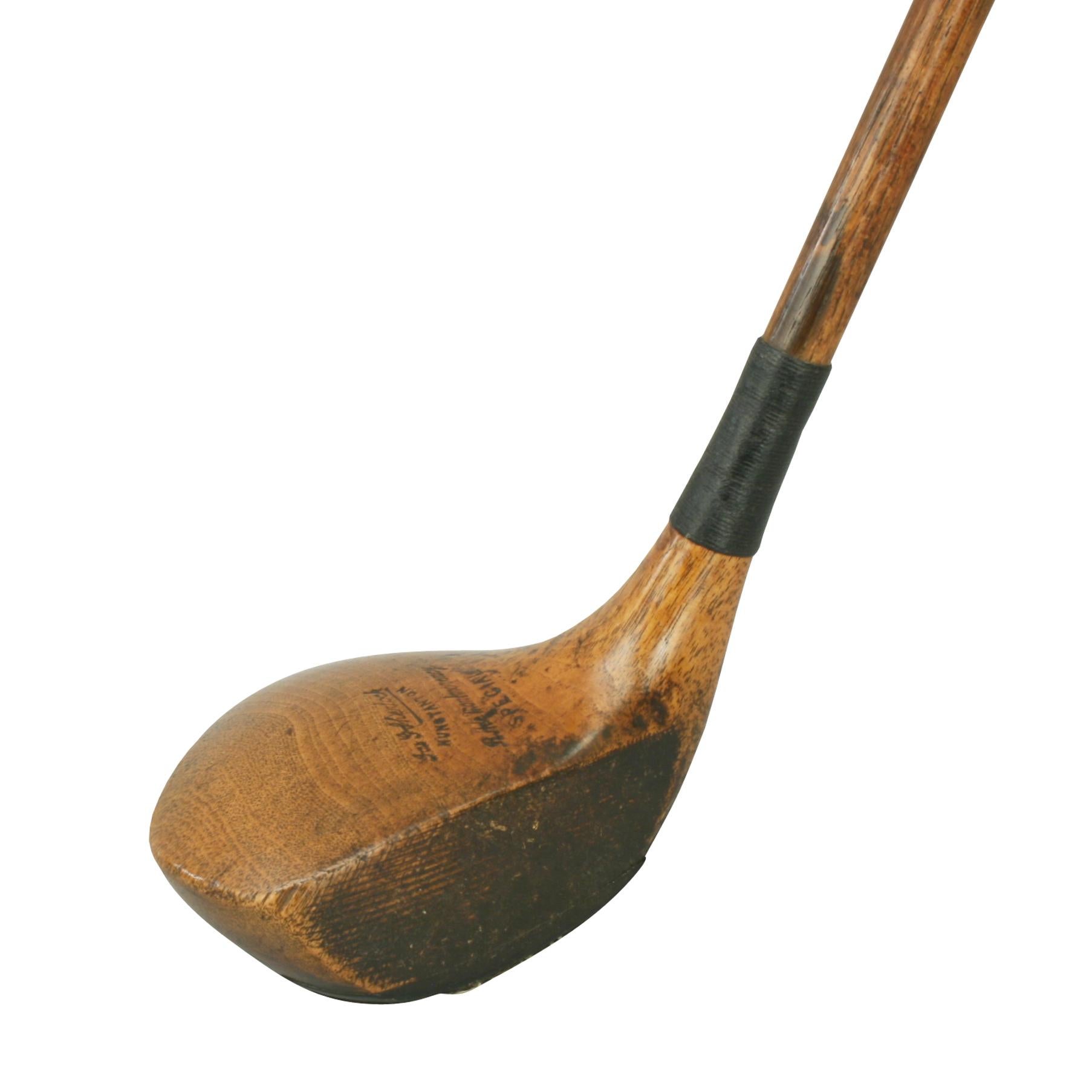 A beautiful socket head persimmon wood golf club, driver with hickory shaft. The club head is with partial brass sole plate and lead weight to the rear. The club head is stamped 'Jas G Sherlock, HUNSTANTON, RHde Montmorency, SPECIAL'. The neck of
