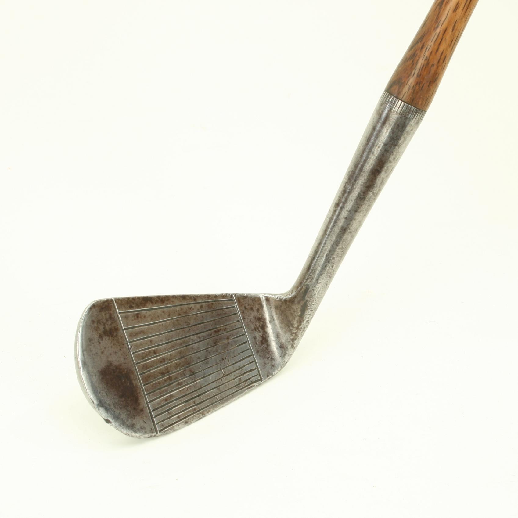 Antique Hickory Golf Club, J. H. Taylor, Mashie.
A Cann & Taylor J. H. Taylor 'Autograph' Mashie with the Reg. No. 303868/08. The club is in original condition with suede leather grip and the club head and hickory shaft both stamped Cann & Taylor